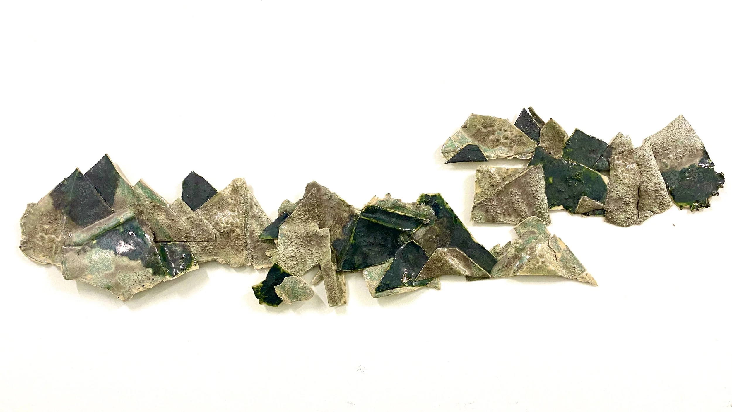 Abstracted Landscape.  2023.
Ceramic stoneware, and Glaze. 
12”h x 30”w x 1”d 