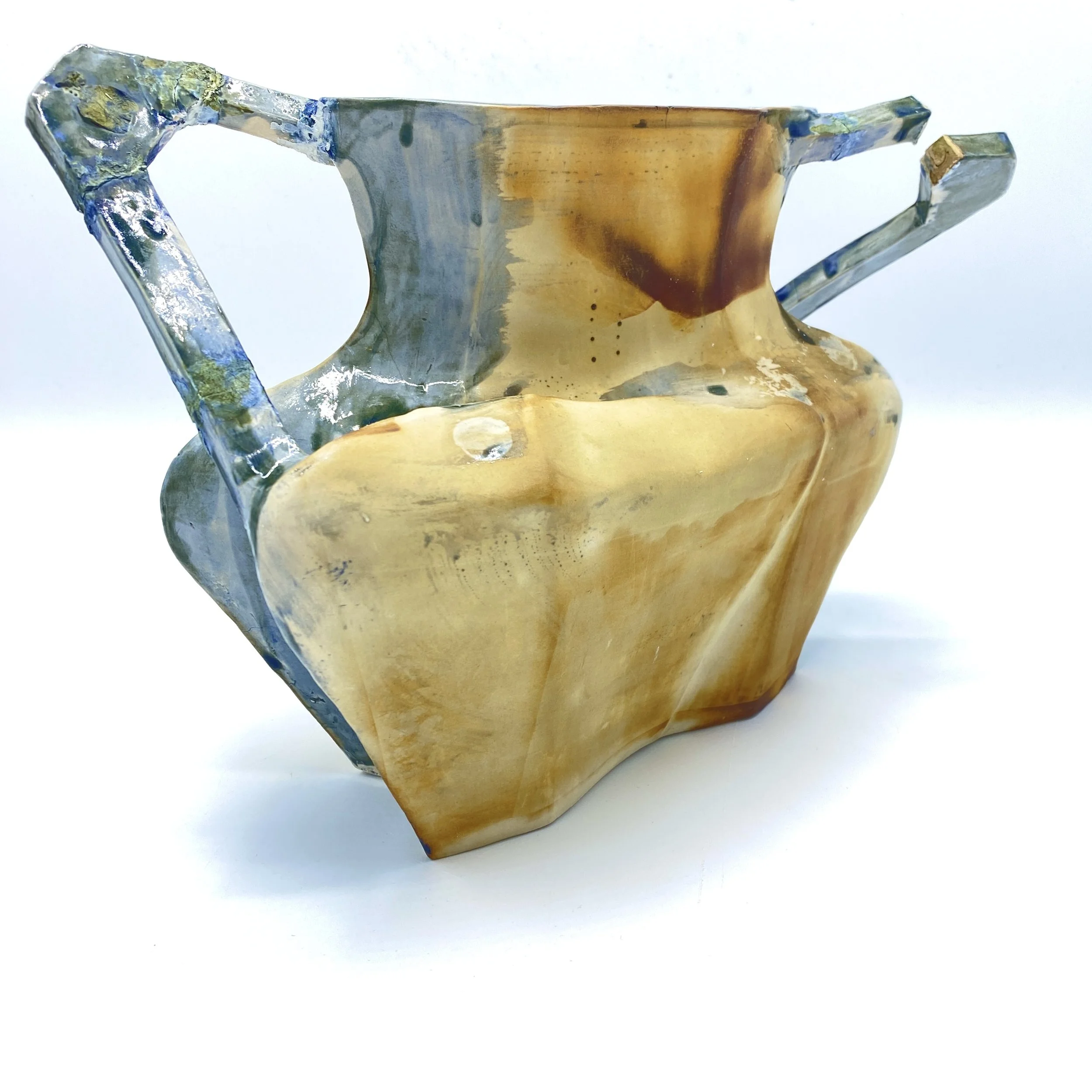 Construction/Deconstruction: Reflections on the World No. 2
2025
Slip-cast porcelain, cyanotype photographs, glazes, and wax. 
9”h x 12”w x 8”d 