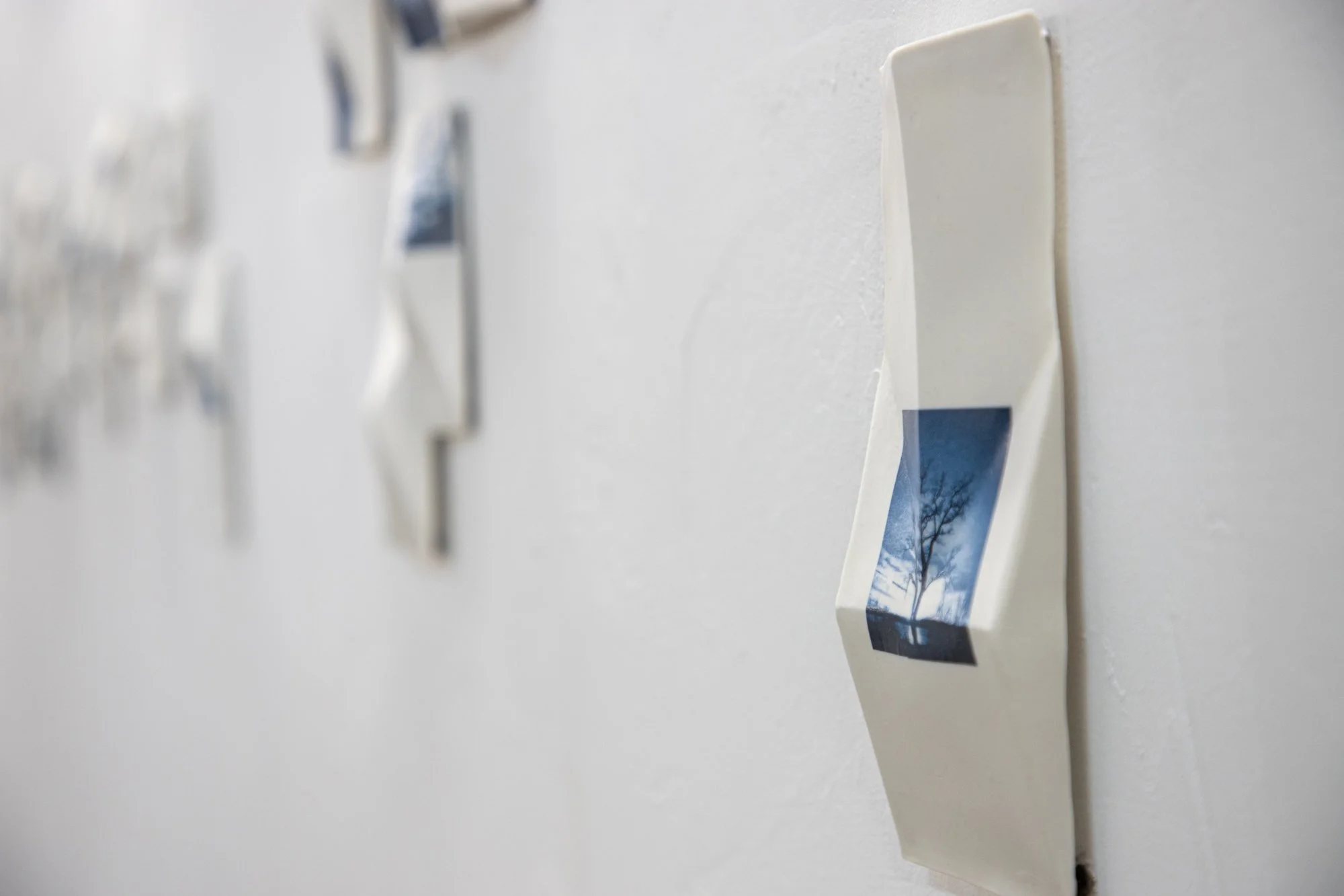 All the Places I (Be)Long 2026 (Detail)
Porcelain with Cobalt on-glaze Photographs.
26” h x 480”w x 1” d