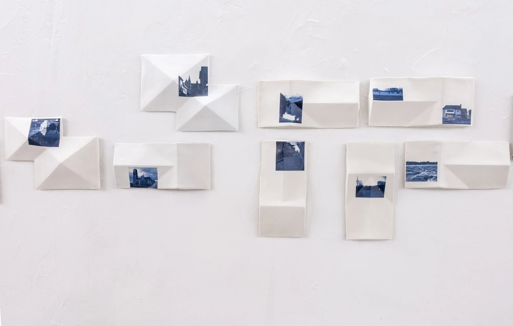 All the Places I (Be)Long 2026. Porcelain and On-Glaze Cobalt Photographic Decals. 
Detail Image.

26” h x 480”w x 1” 
