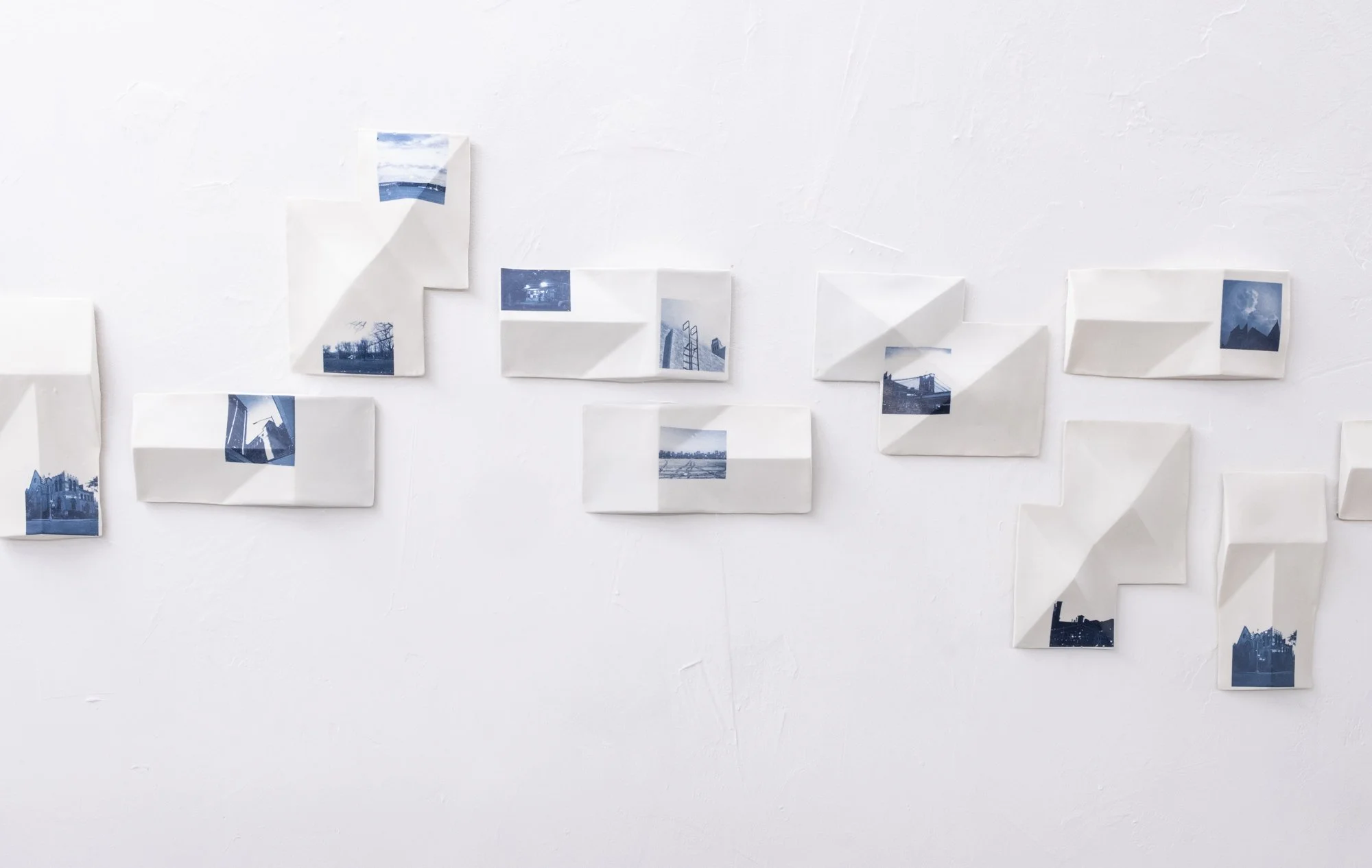 All the Places I (Be)Long  2026. Porcelain and On-Glaze Cobalt Photographic Decals. 
Detail Image.

26” h x 480”w x 1” 