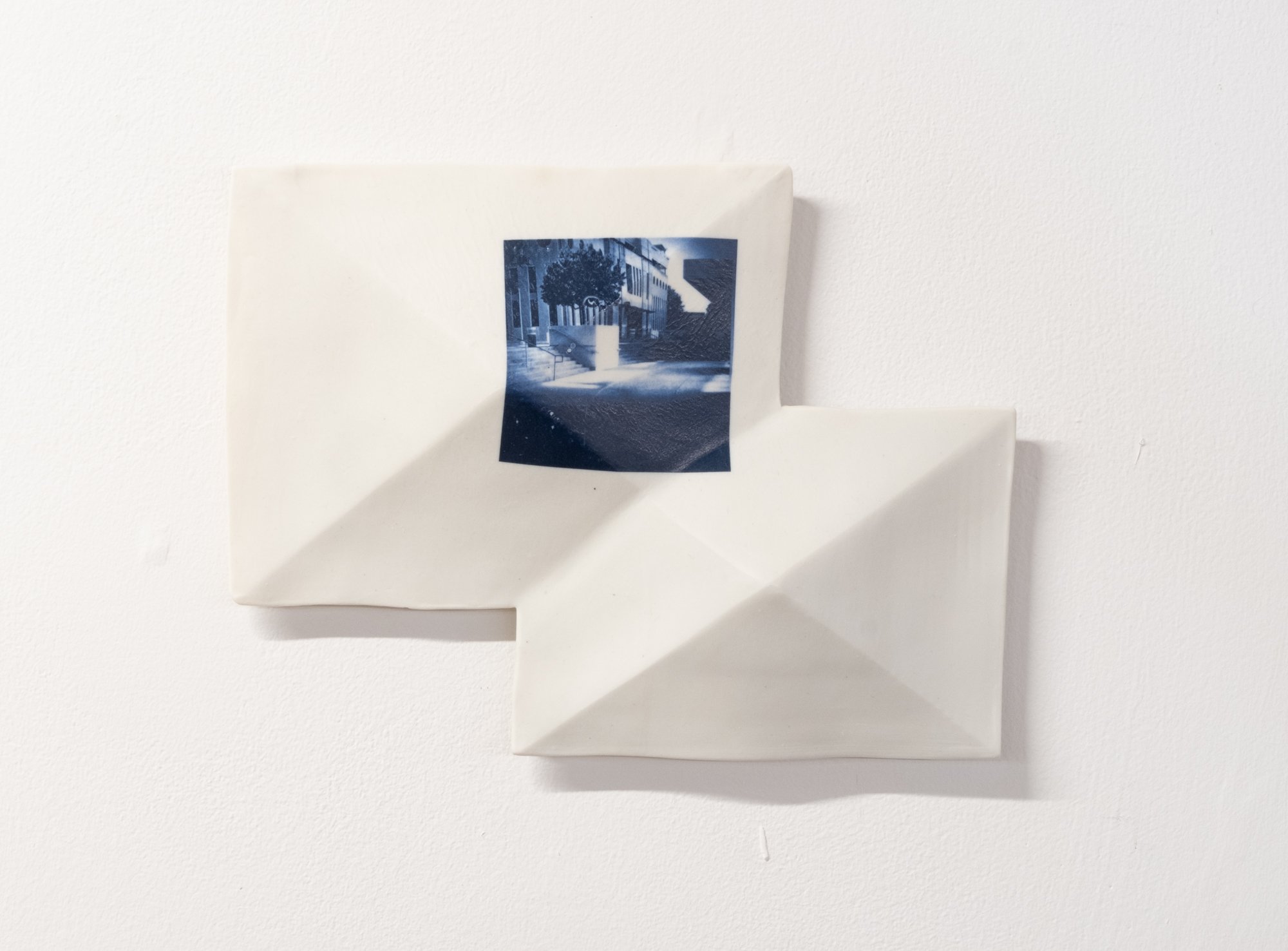 All the Places I (Be)Long Vignette no.2 2026. 
Porcelain and On-Glaze Cobalt Photographic Decals. 10"h x 12"w x 1"d