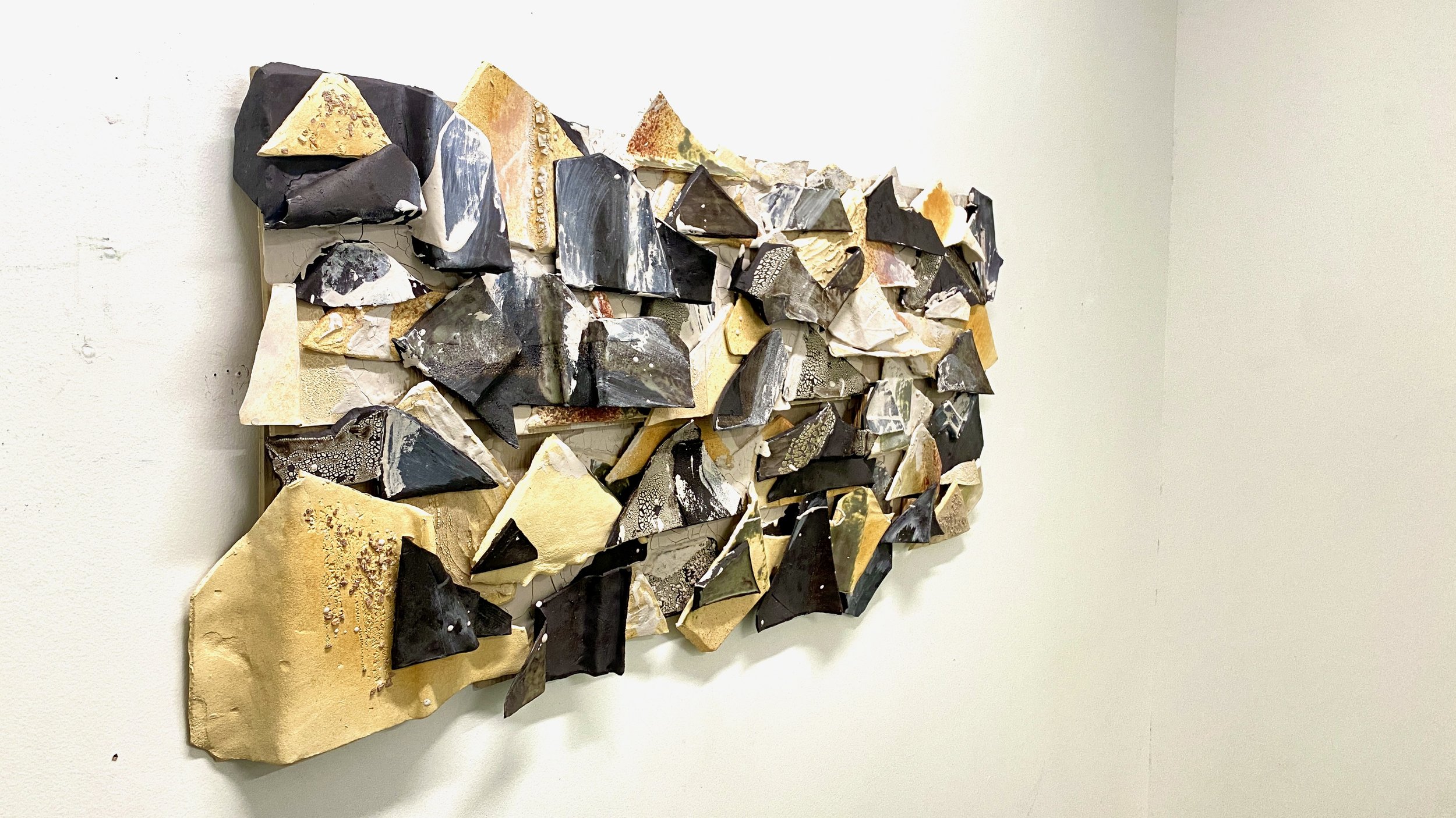 Chaos and Control. 2024. Side View Detail
Ceramic stoneware, Glaze, Hardie-board, and Raw Clay. 
25”h x 48”w x 6”d