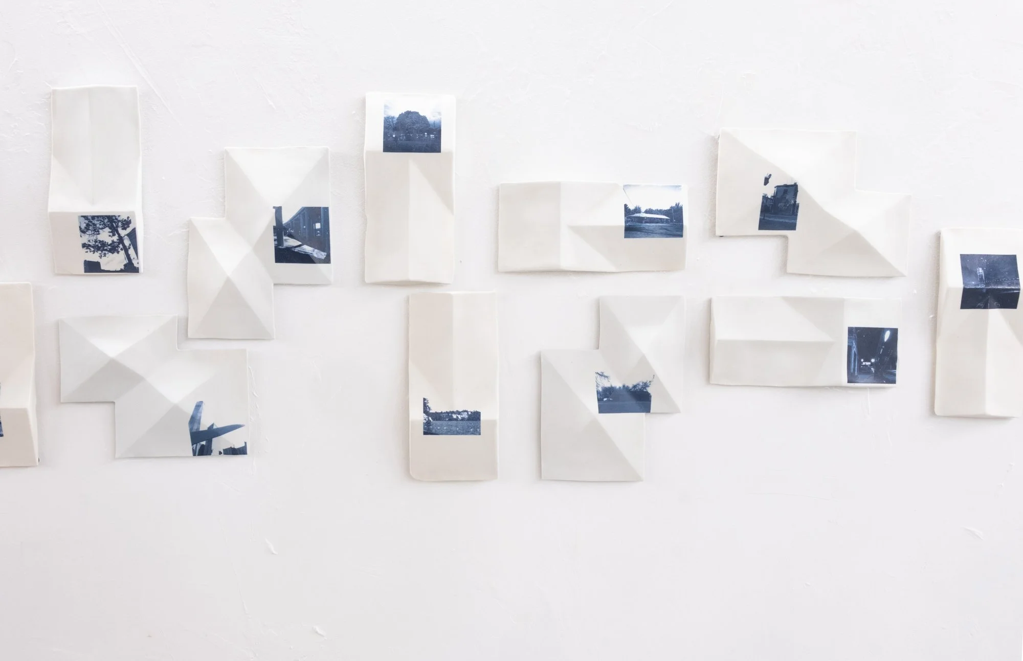 All the Places I (Be)Long 2026. Porcelain and On-Glaze Cobalt Photographic Decals. 
Detail Image.

26” h x 480”w x 1” 