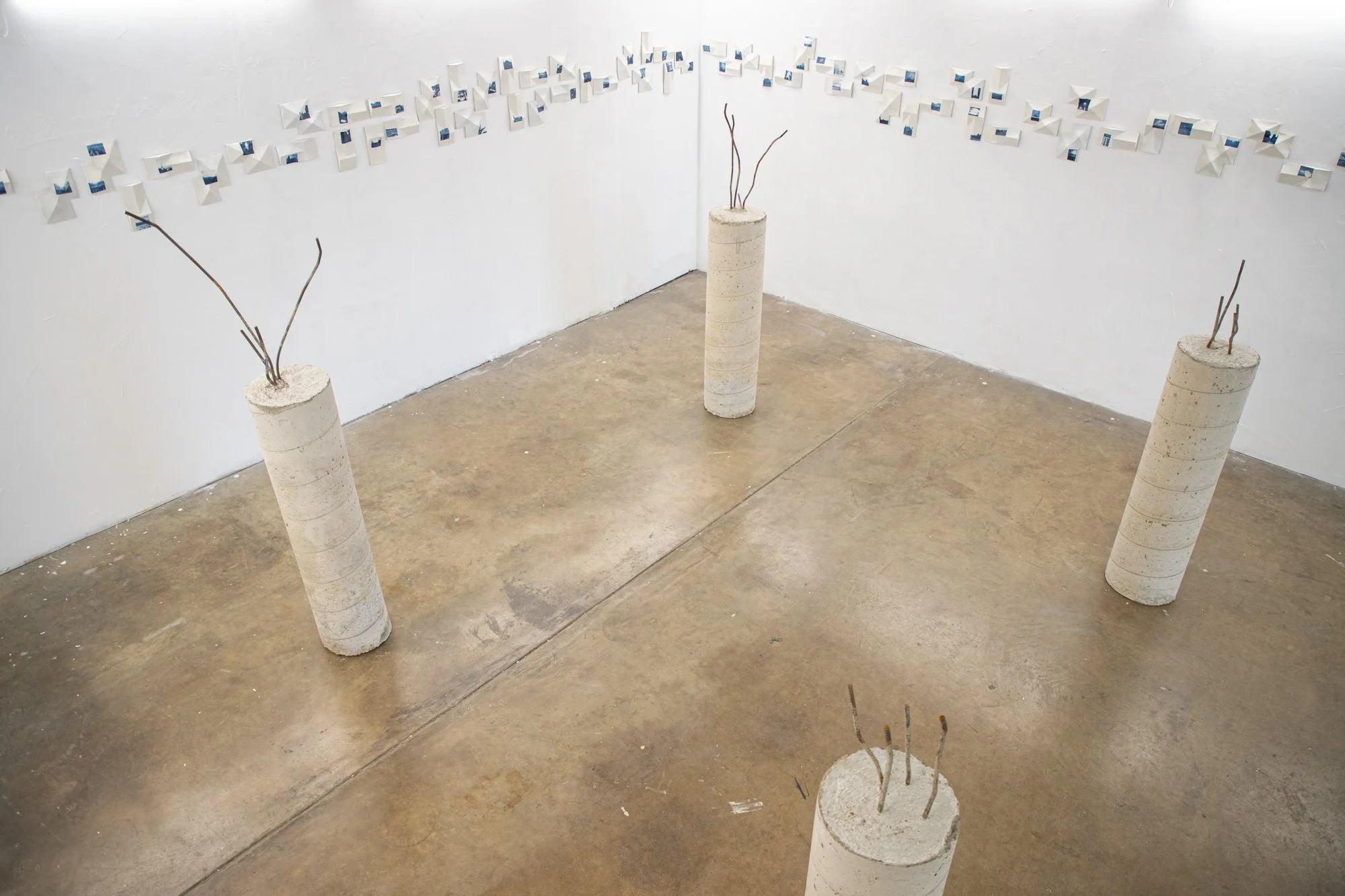 All the Places I (Be)Long  2026. Porcelain and On-Glaze Cobalt Photographic Decals. Installation View April 2026.

26” h x 480”w x 1” 