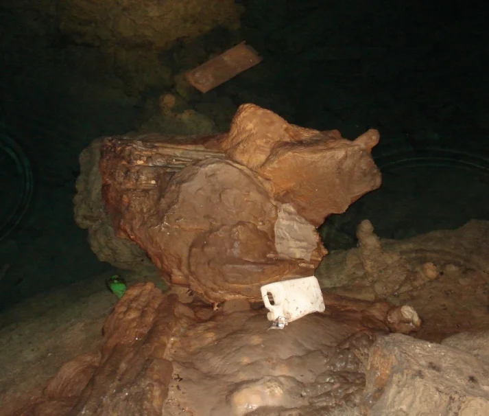 Garbage washed through a tidal cave