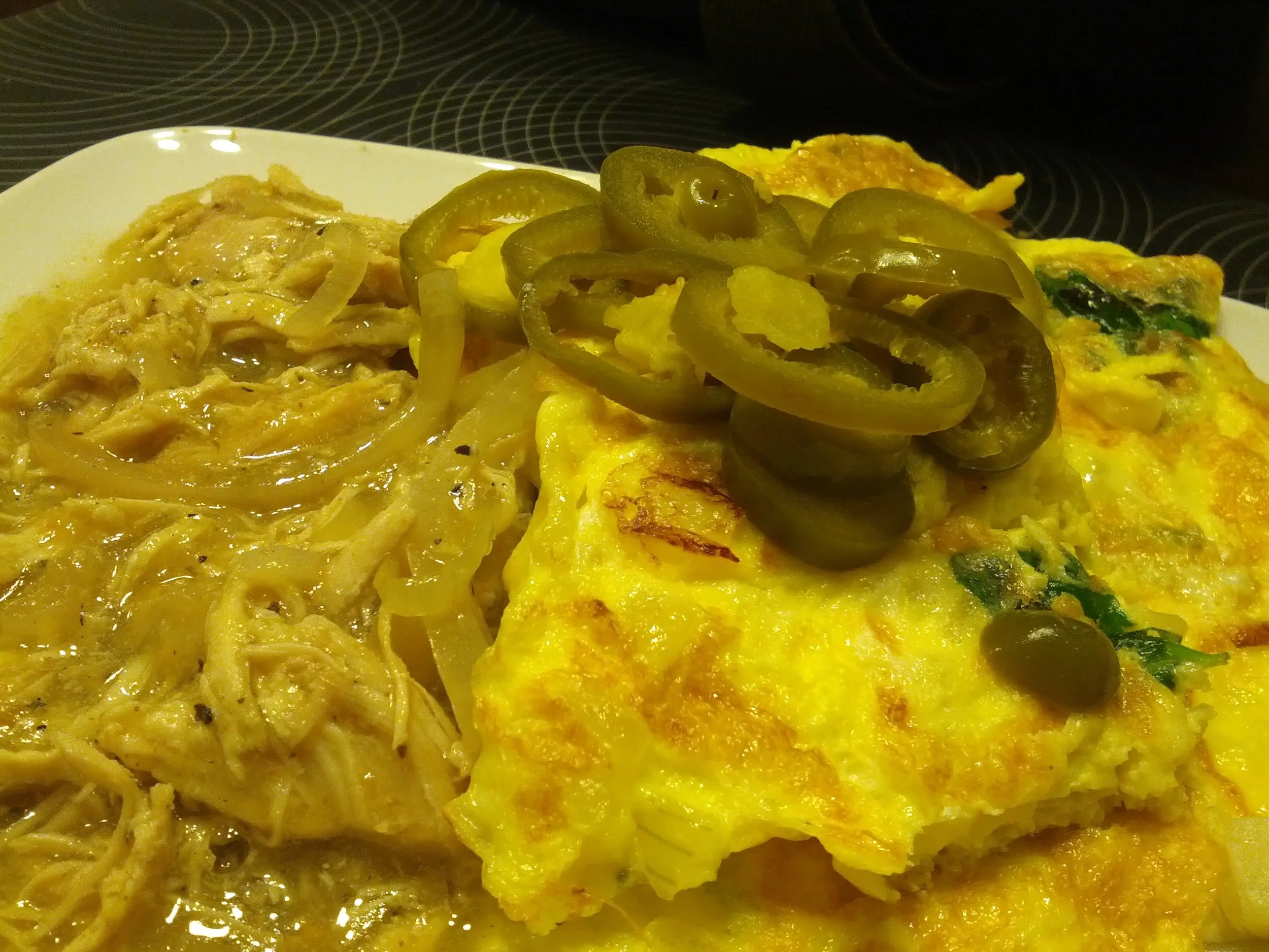 Tuesday morning breakfast, chicken chili con verde with scrambled eggs and jalapenos.