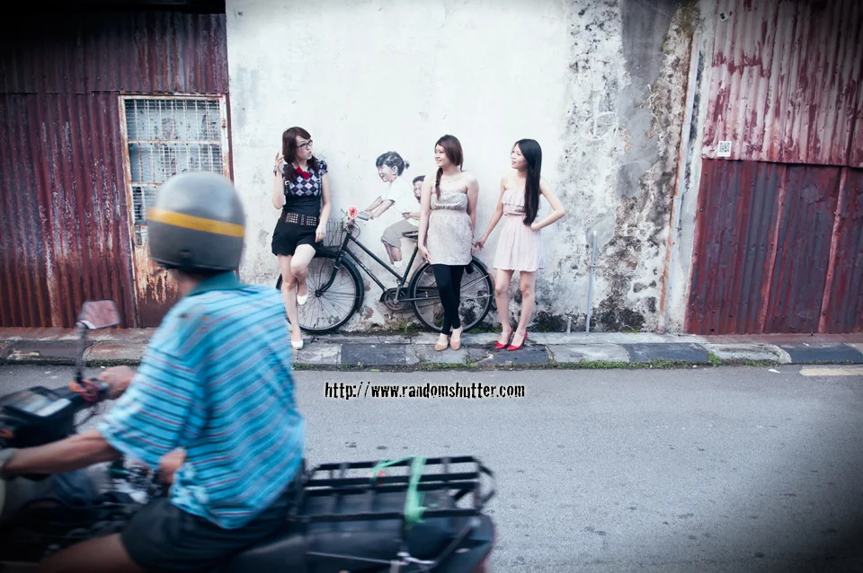 Absolutely love the motorcyclist driving by and the girls just totally oblivious to him.