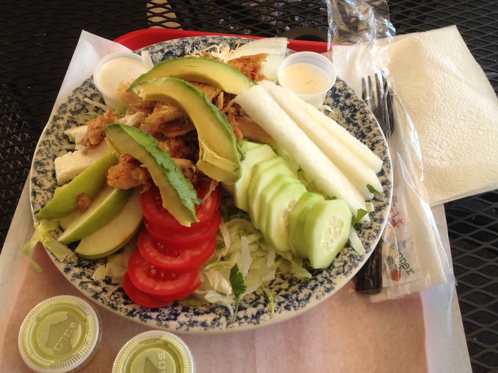 big fresh salad with option or adding more fruit or meat for $6