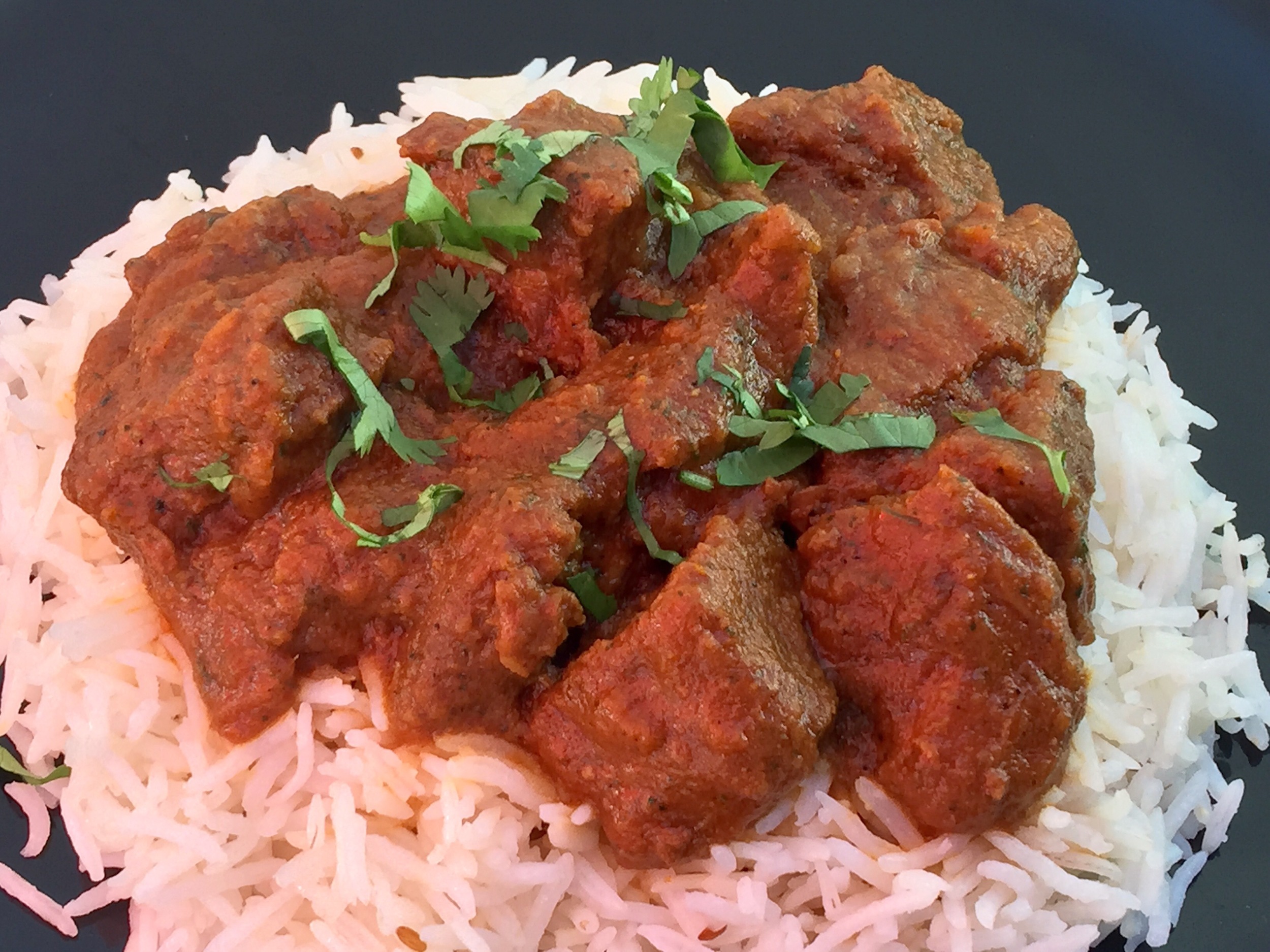 Lamb curry . Boneless tender piece prepared with ginger garlic sauce and spices.