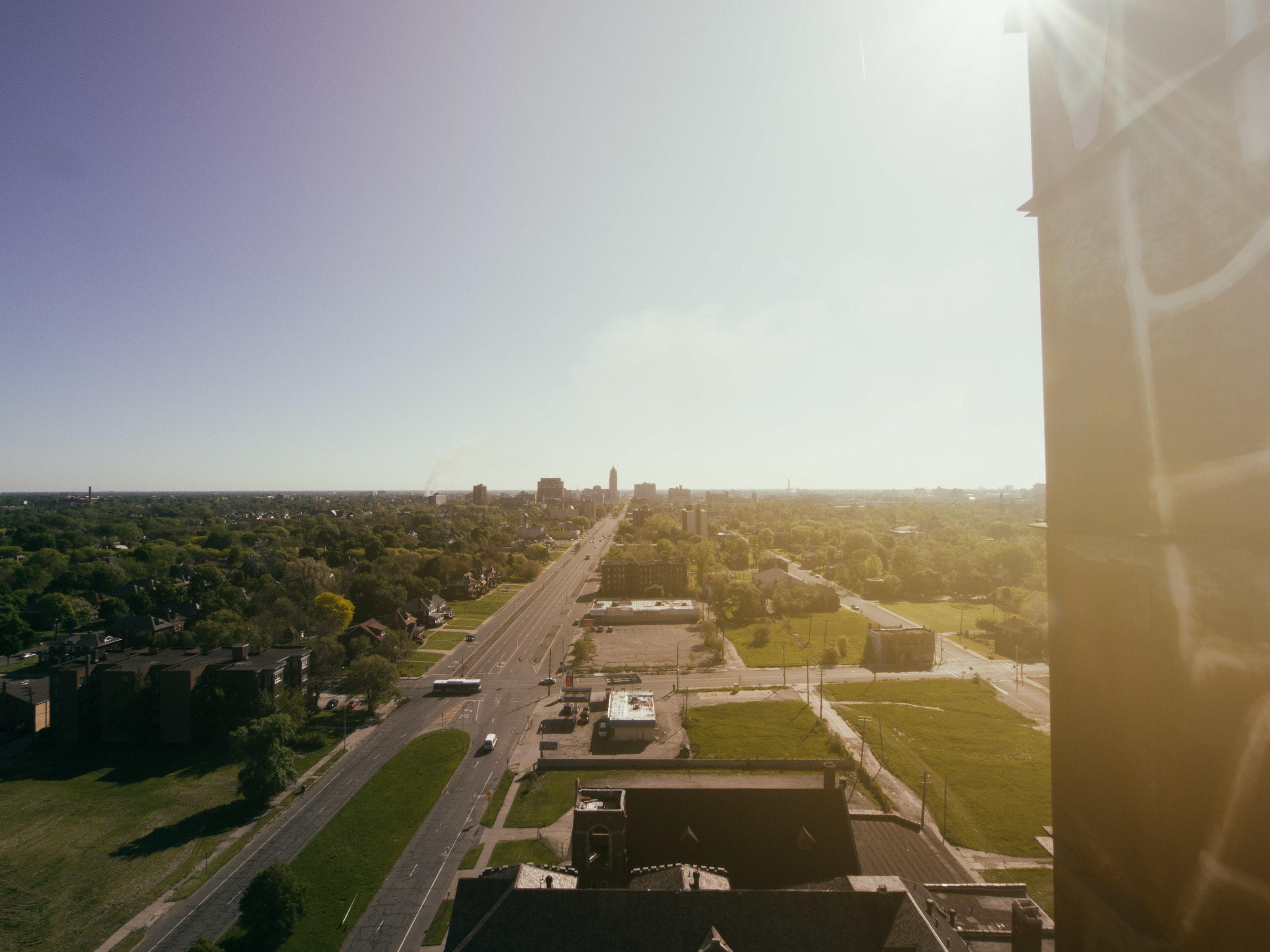 Reaching the open air portion of the rooftop the spring breeze and warm sunshine sort of washed away all the anxiety of being in such a desolate place. Off in the distance you can see the smoke from a large structure fire.