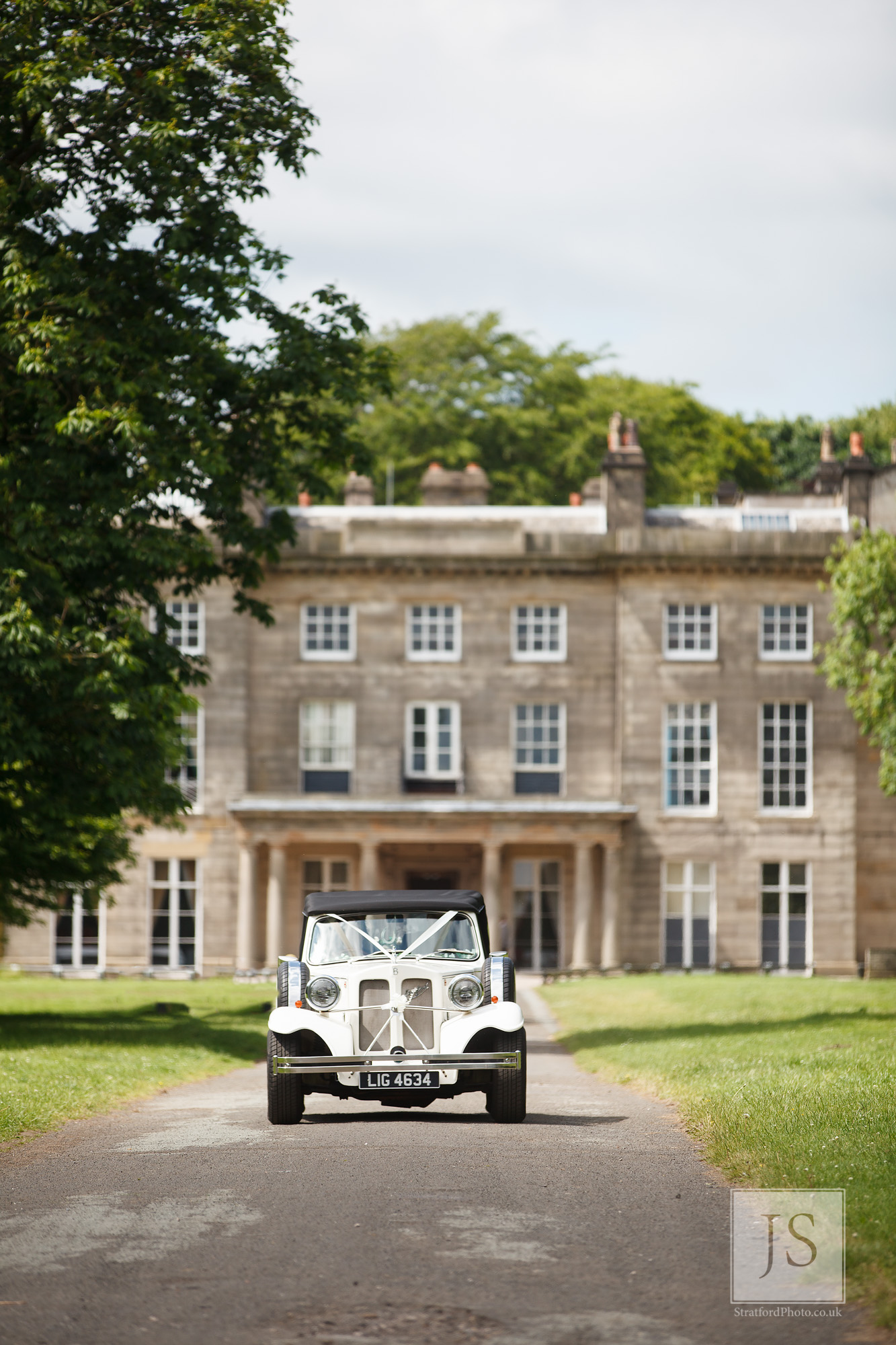 A classic Bentley drives down the driveway at Heigh Hall.jpg
