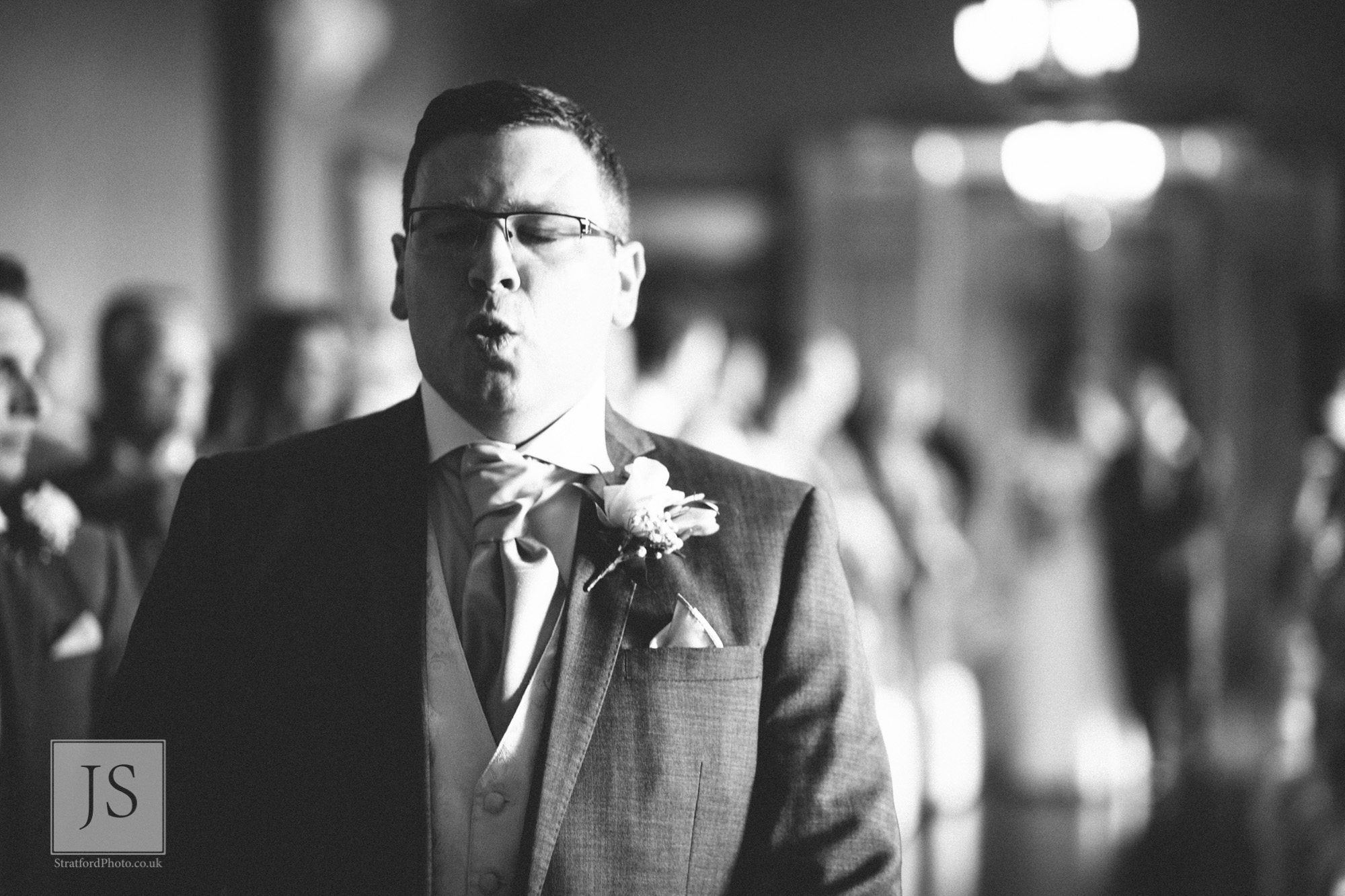 A nervous groom waits for his bride at Haigh Hall.jpg