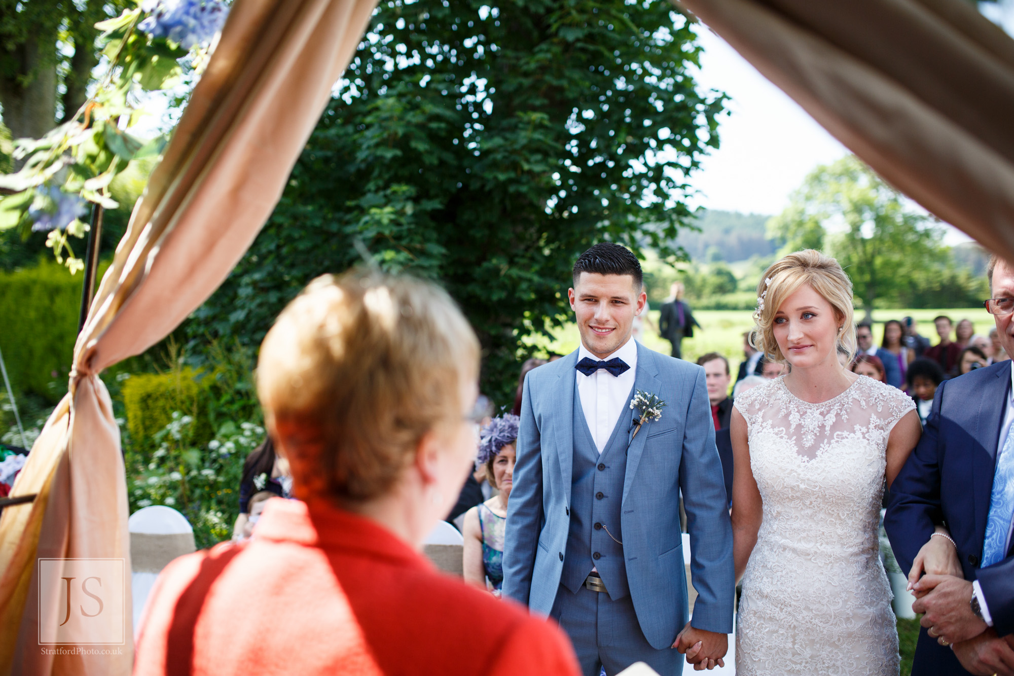 A bride and groom prepare to make their vows.jpg