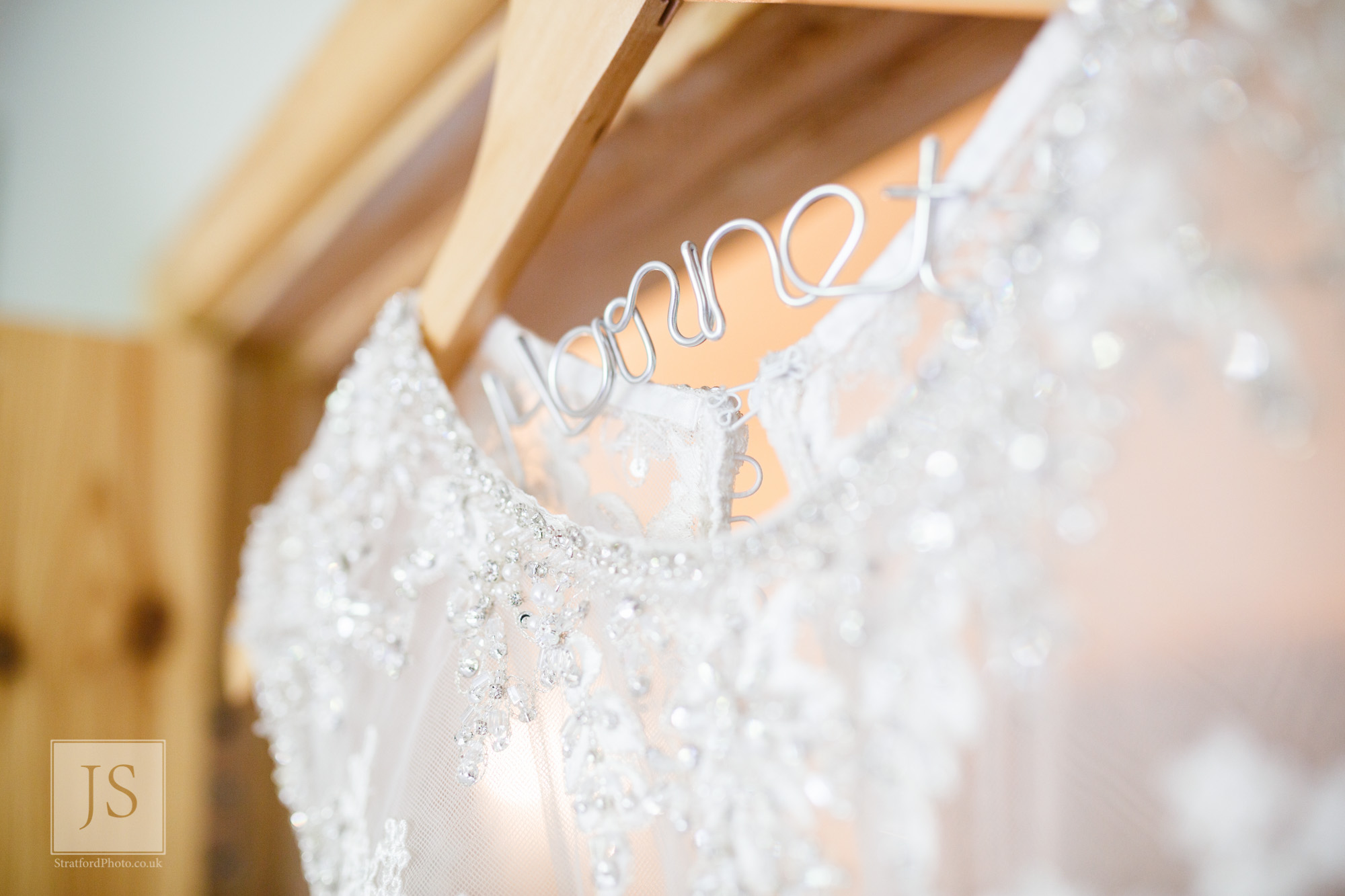 A coathanger shows the brides new name.jpg