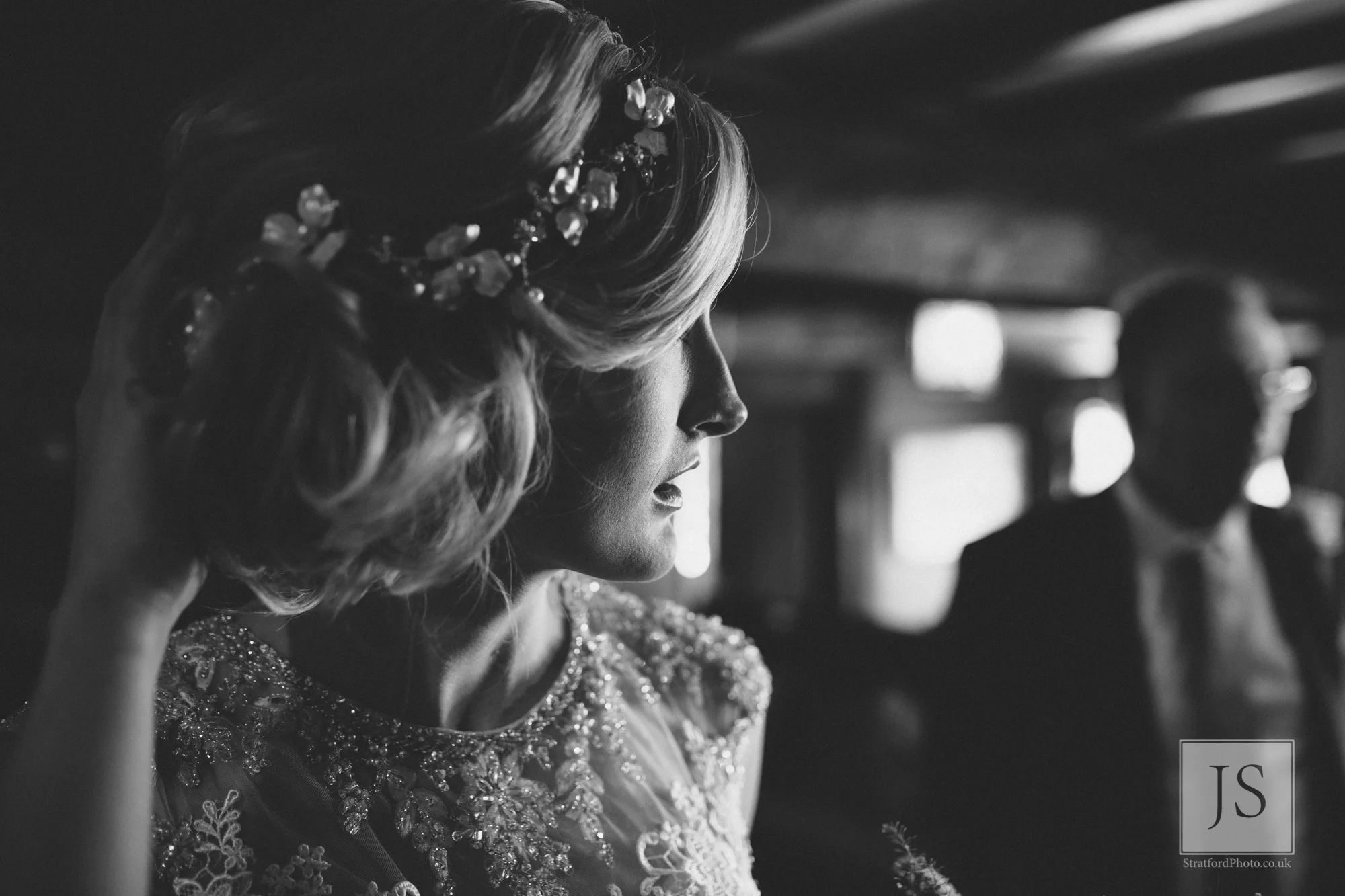 A nervous bride checks her hair before her ceremony.jpg