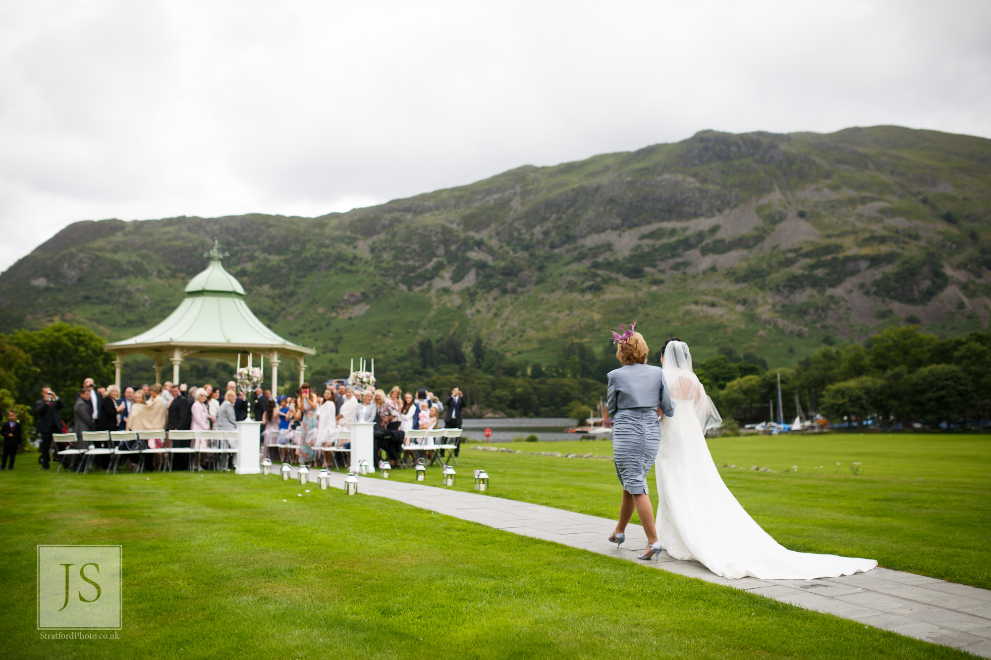 A mother and bride walk down the aisle at Ullswater.jpg