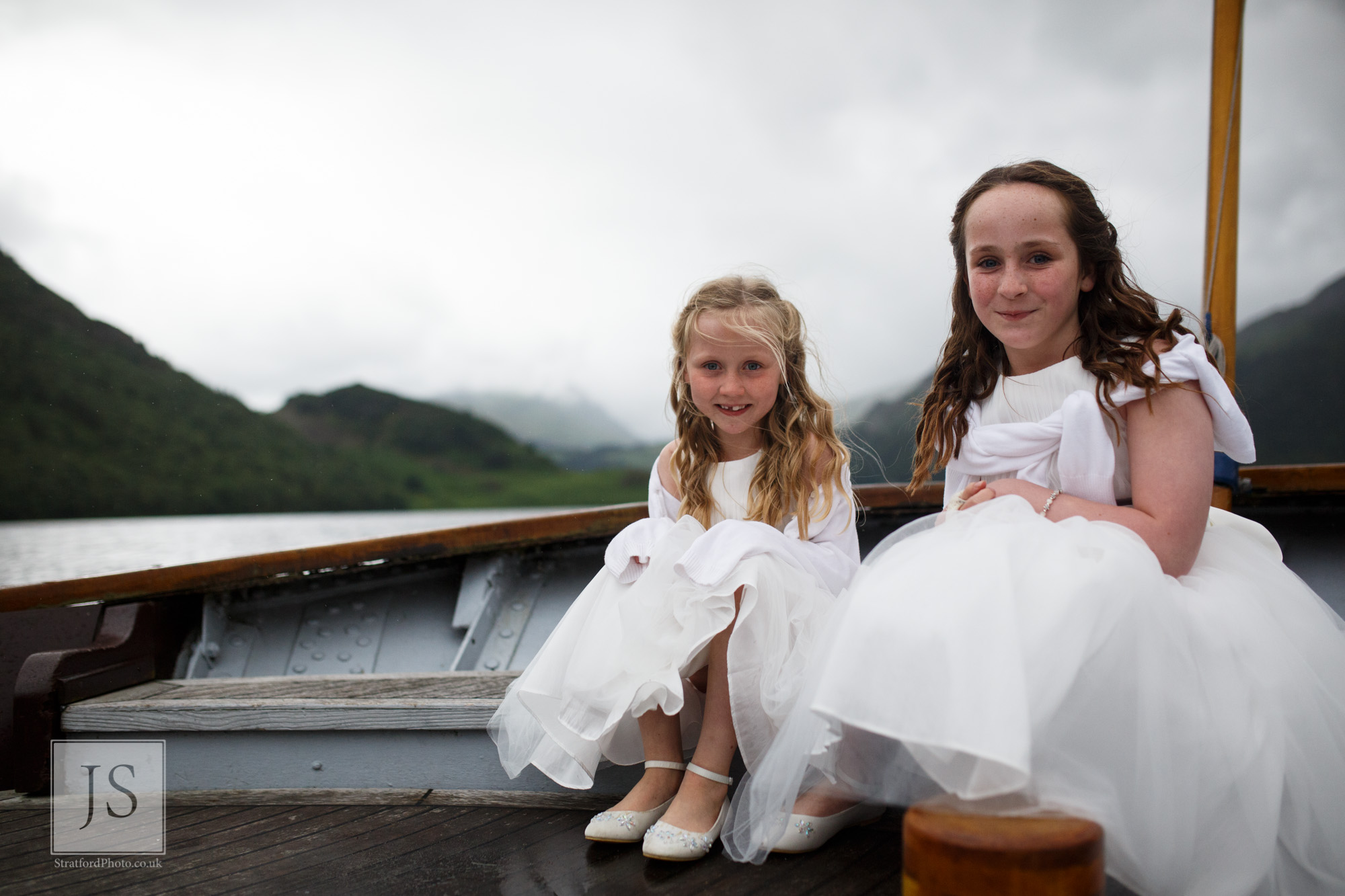 Two young flower girls pose on the stern of a Lake Ullswater steamer boat.jpg