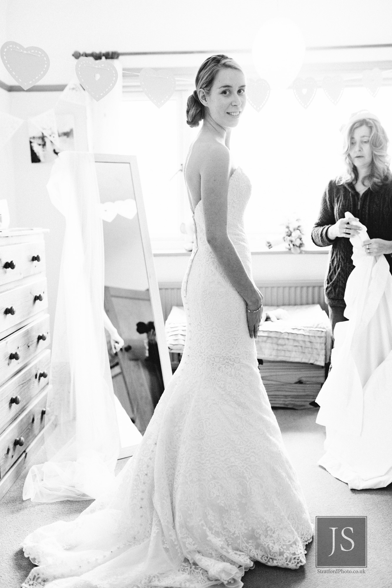 A bride poses in her wedding dress in the morning.jpg