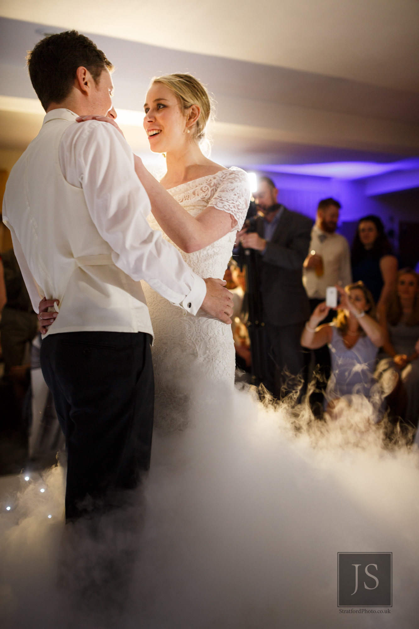 A bride and groom share their first dance in dry ice.jpg