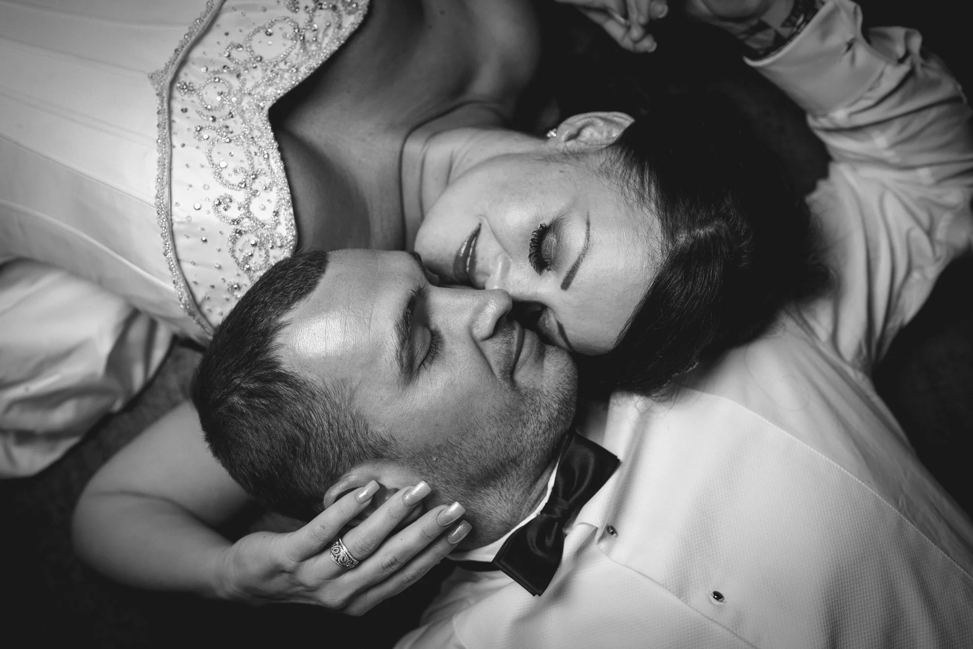 A bride and groom embrace