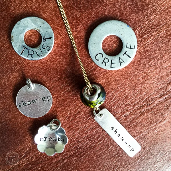 Words of the Year from 2014 & 2015. My sister made the washers. The charms are by The Vintage Pearl.