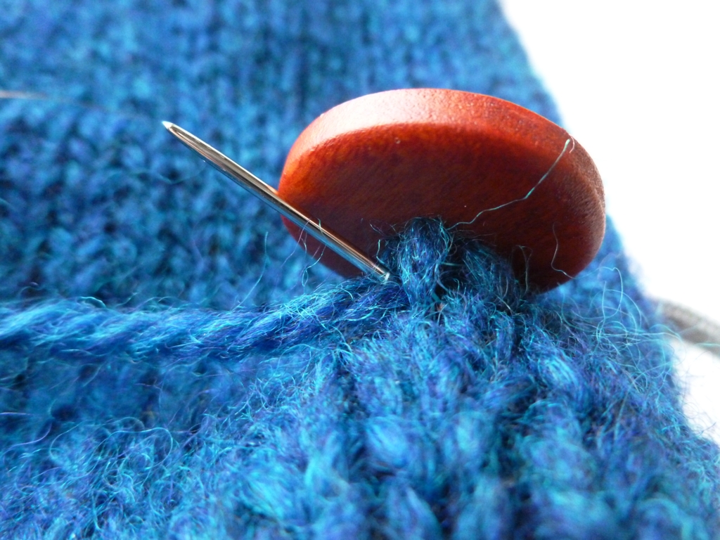 How to Sew on a Button with Handspun Yarn | withwool.com