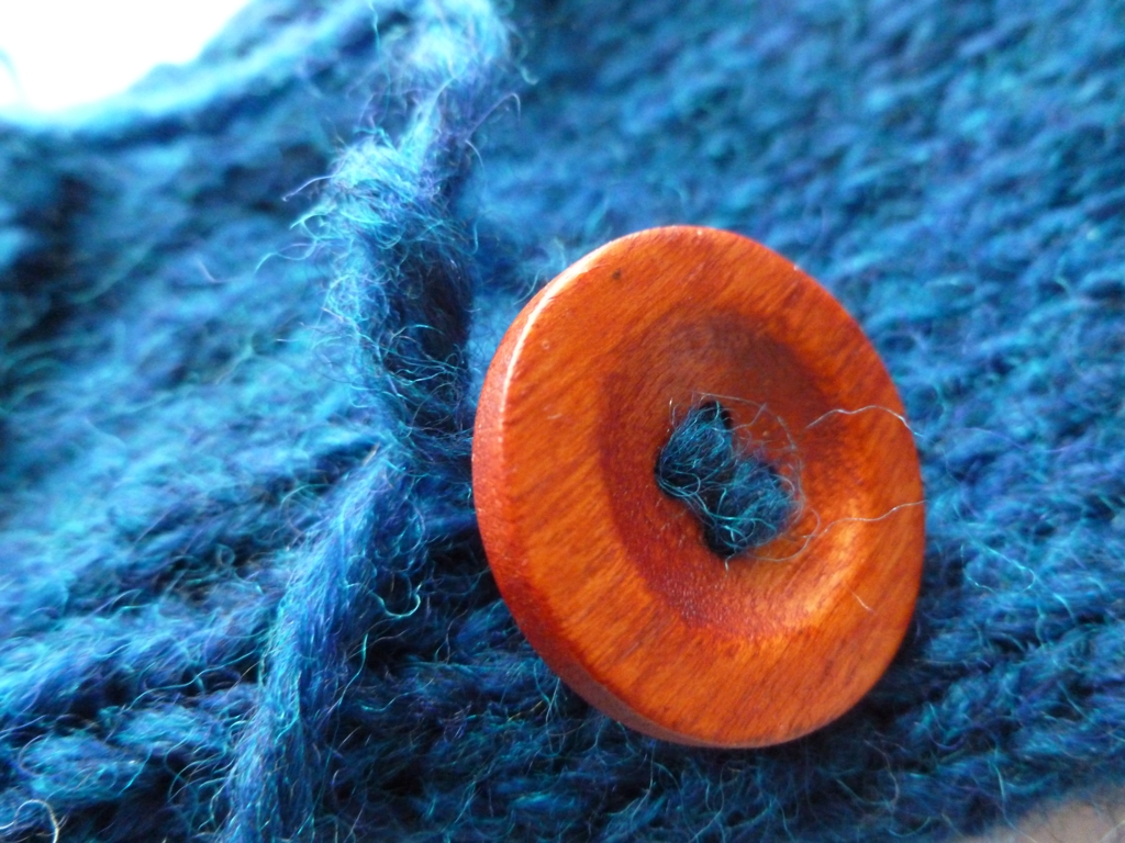 How to Sew on a Button with Handspun Yarn | withwool.com