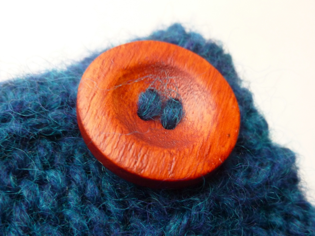 How to Sew on a Button with Handspun Yarn | withwool.com
