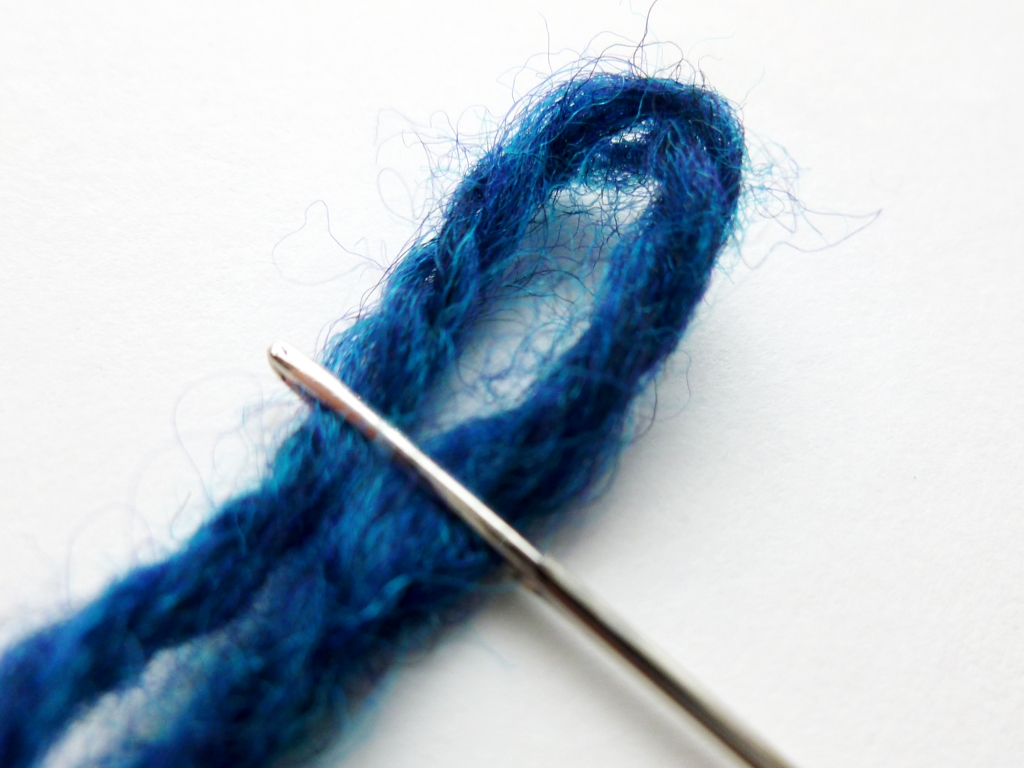 How to Sew on a Button with Handspun Yarn | withwool.com