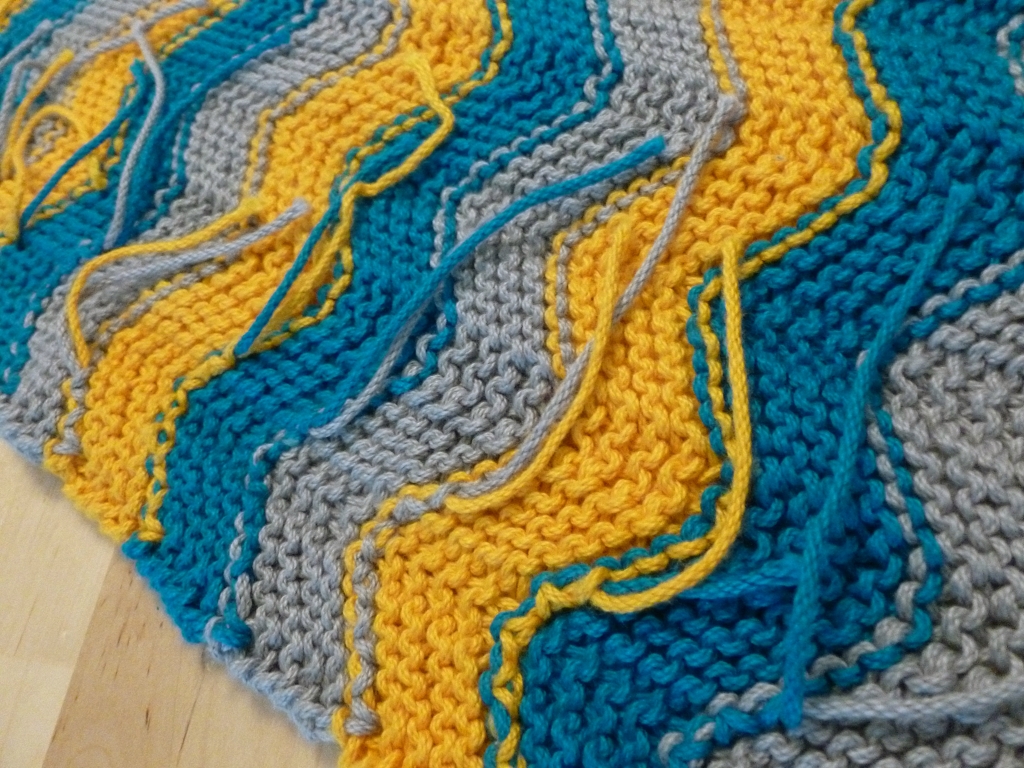 Learn how to weave in ends without a tapestry needle as you knit! | withwool.com