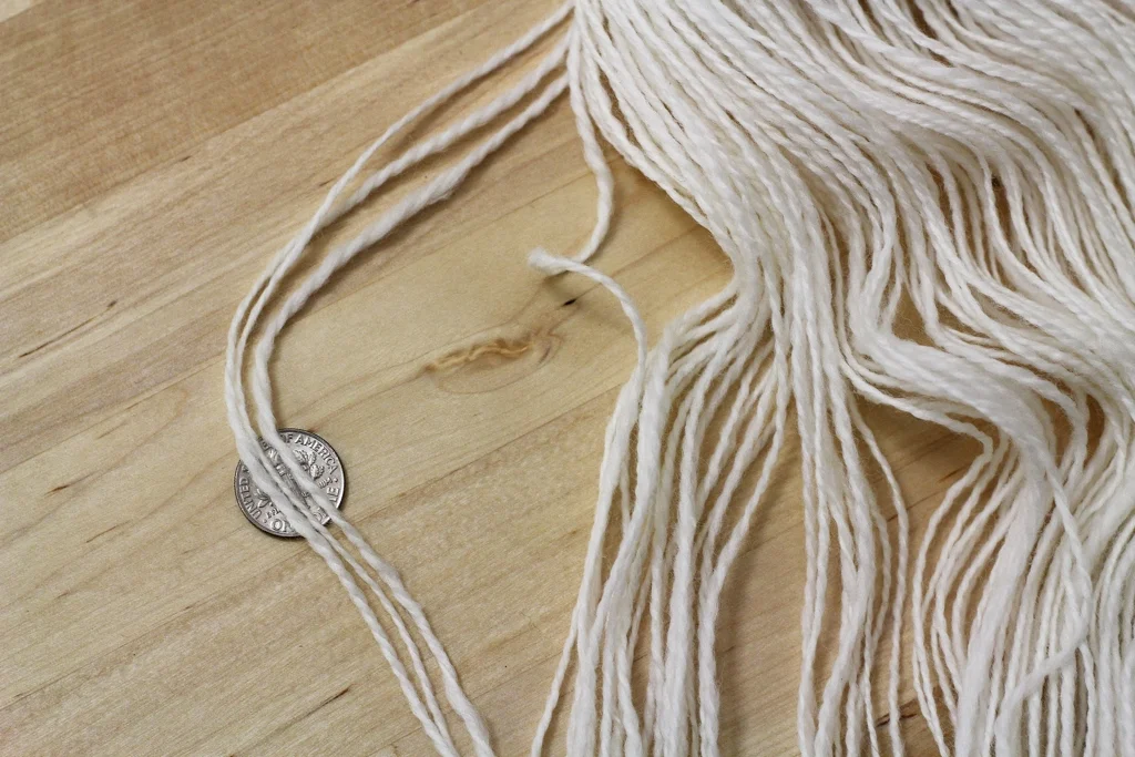 A little uneven and limp, the yarn is ready to be finished with a good soak. Cashmere is as soft as everyone says it is, and here's how I turned 2 oz of it into yarn. | Notes About Spinning Cashmere - withwool.com