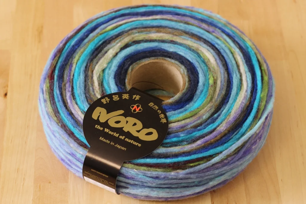 Pencil roving can be spun, knit, or woven into beautiful things. This review gives a head to head comparison of 2 different pencil rovings, Noro Rainbow Roll and Imperial Bulky 2-Strand. | Review: Comparing Noro Rainbow Roll and Imperial Yarn Bulky 2-Strand Pencil Roving