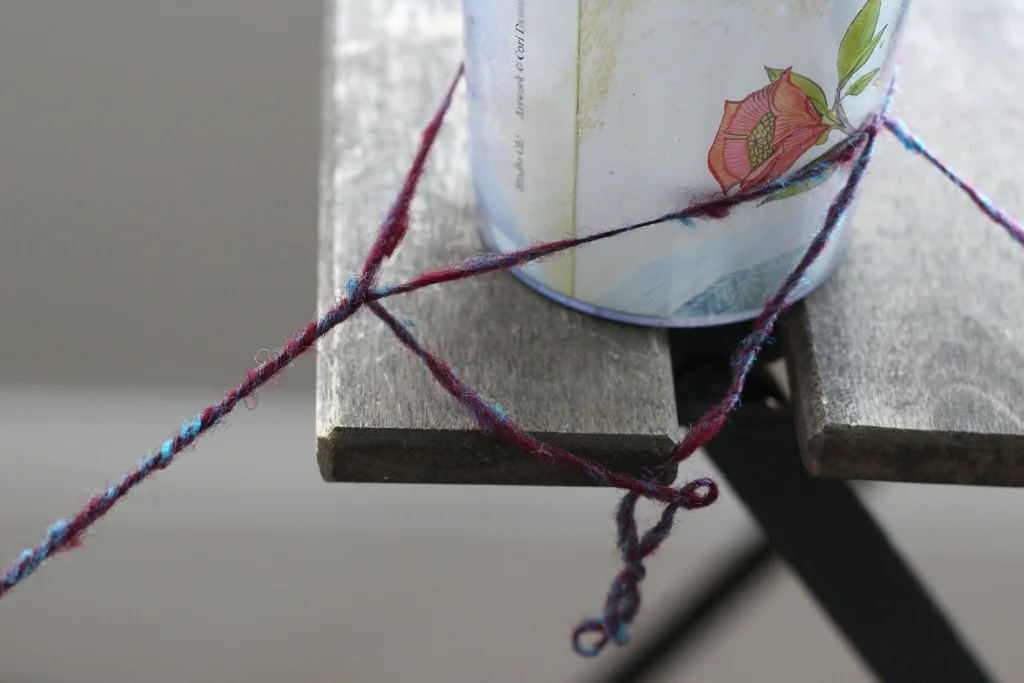 Mugs, cups, and cardboard tubes make it so easy to take a break when you’re in the middle of chain-plying handspun. | My Favorite Chain-Plying Trick - withwool.com