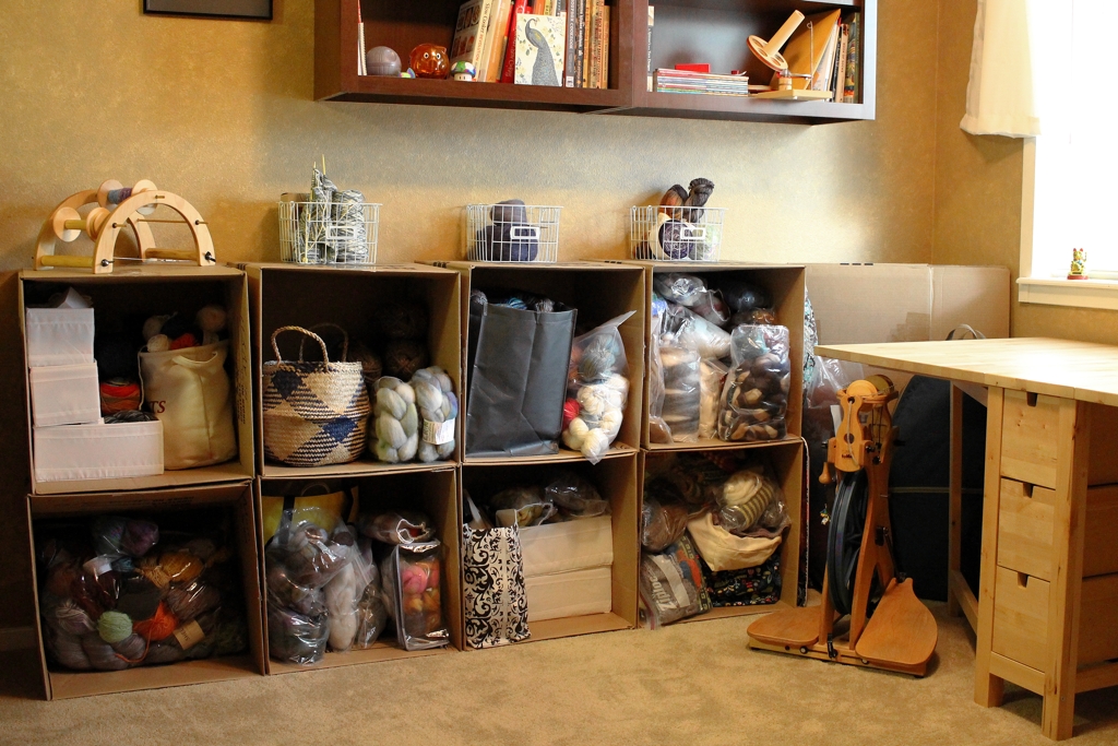Cardboard boxes to the rescue! I don’t have shelves yet, but these boxes will do the job until in the meantime. Yarn Storage - Boxes To The Rescue | withwool.com