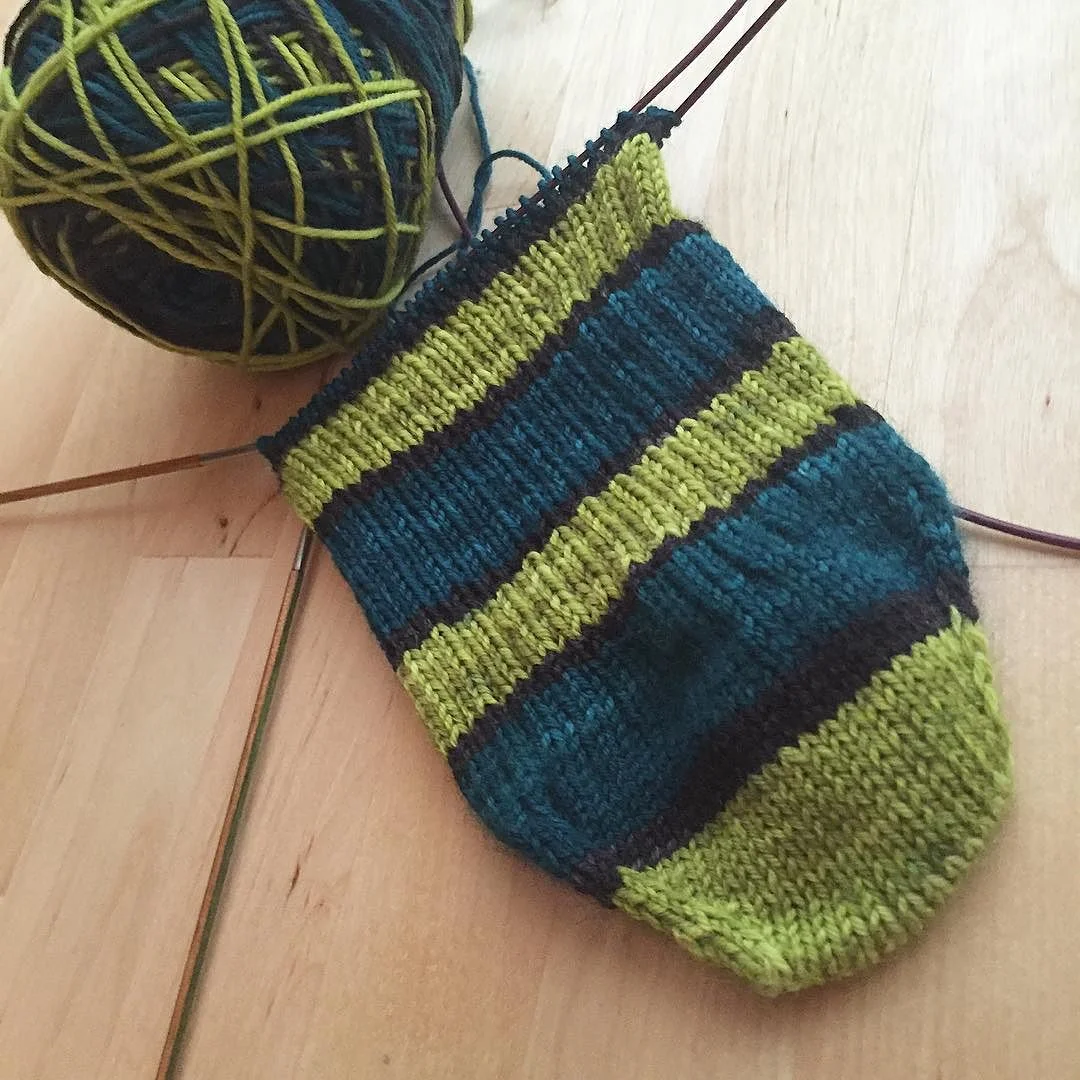 Simple, self-striping socks are a perfect travel project, especially with afterthought heels or legs. Self-Striping Travel Goodness | withwool.com