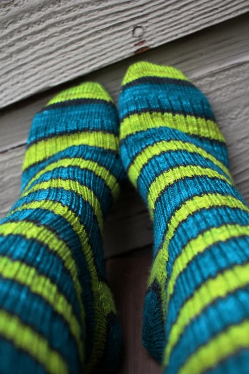 Self striping yarn knits up into great afterthought socks. This pair is going away to wait for cold snowy days. FO: TurtlePurl Socks | withwool.com