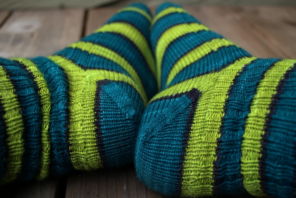 Self striping yarn knits up into great afterthought socks. This pair is going away to wait for cold snowy days. FO: TurtlePurl Socks | withwool.com