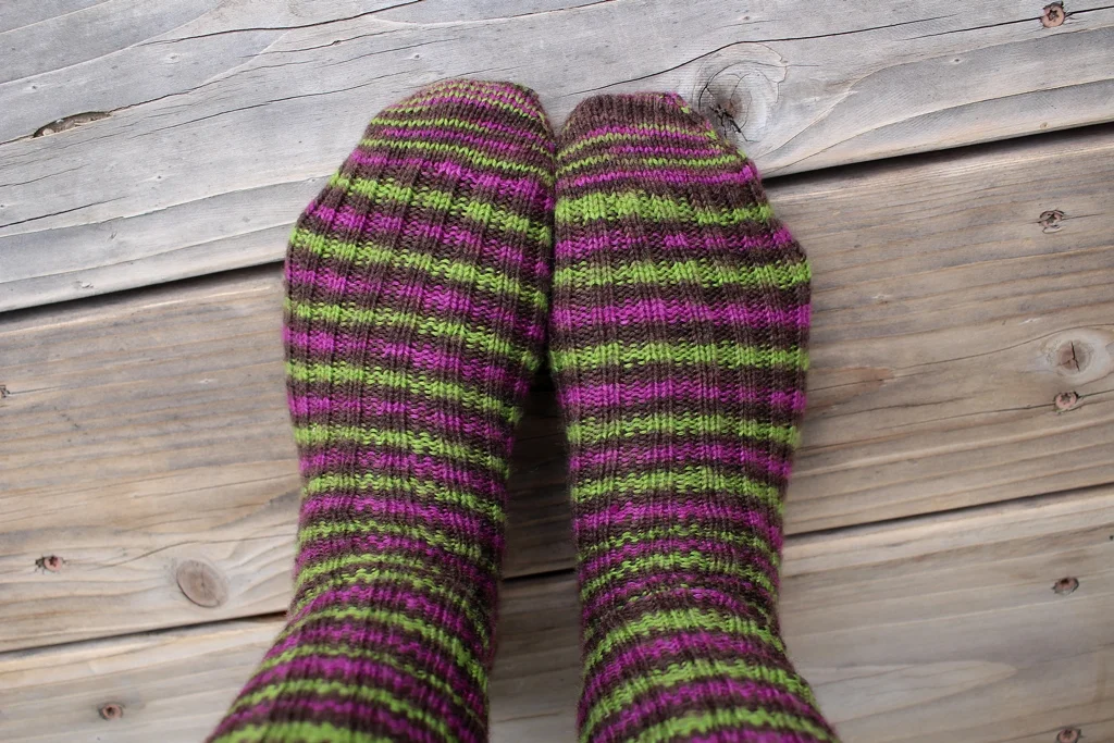 Toe-up socks with afterthought cuffs make perfect travel knitting. | withwool.com