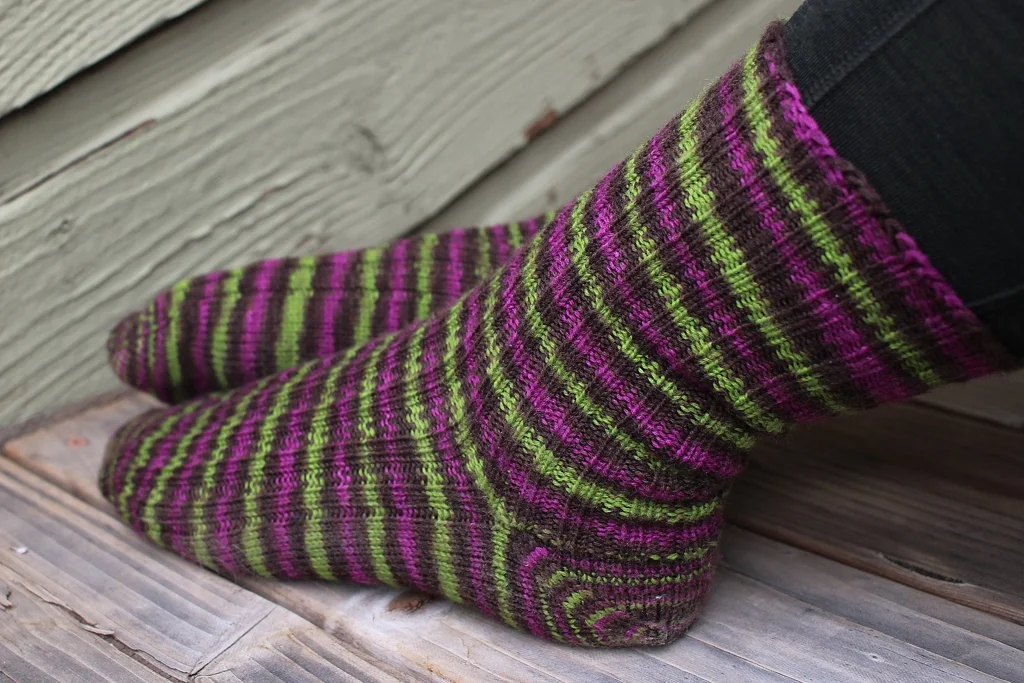 Toe-up socks with afterthought cuffs make perfect travel knitting. | withwool.com