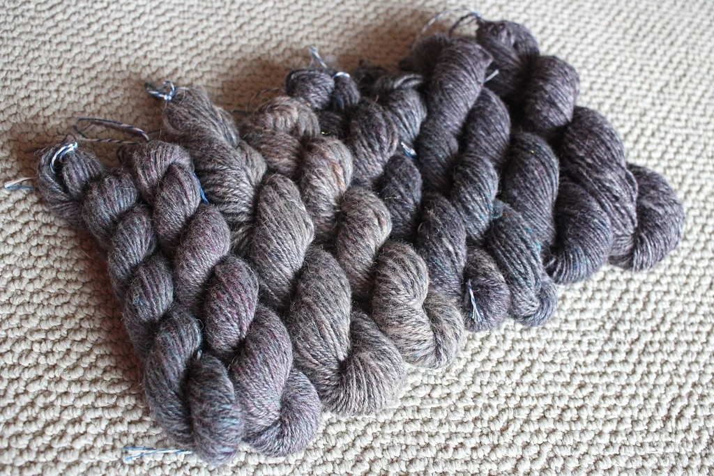 8 handspun skeins, 6 ounces of roving, and 1 beautiful color gradient. I spent almost 2 months spinning this yarn, and it was worth the effort. | withwool.com