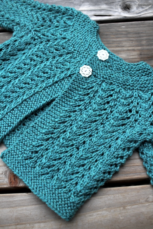 Pithy instructions, a little garter stitch, and a bunch of lace make up the famous February Baby Sweater. It’s a good test of knitting skill too. | withwool.com