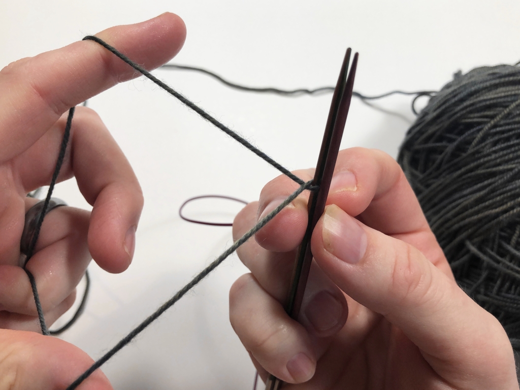 Learn how to work Judy’s Magic Cast-On to seamlessly start knitting in knit or purl. It’s a great cast-on to use for toe-up socks and other projects that start from the center out. #knitting #knittingcaston #knittingtutorials | withwool.com