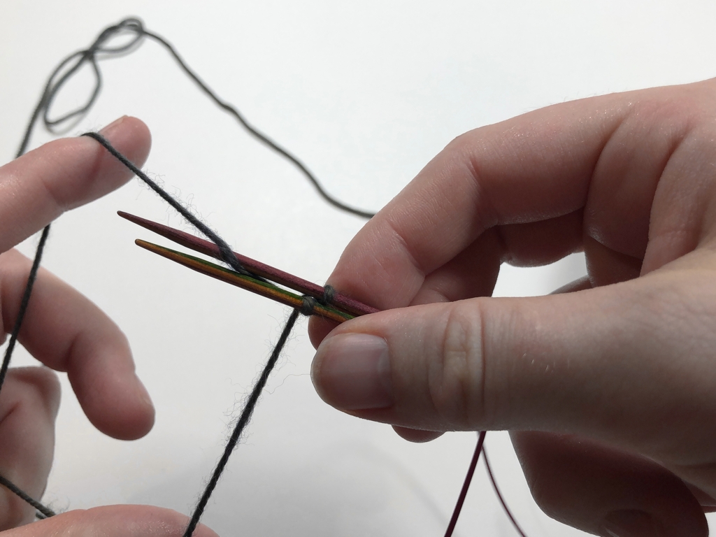 Learn how to work Judy’s Magic Cast-On to seamlessly start knitting in knit or purl. It’s a great cast-on to use for toe-up socks and other projects that start from the center out. #knitting #knittingcaston #knittingtutorials | withwool.com