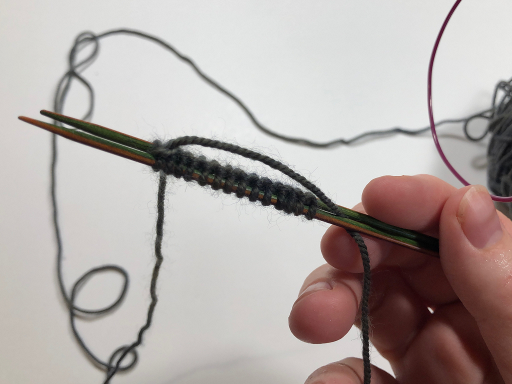 Learn how to work Judy’s Magic Cast-On to seamlessly start knitting in knit or purl. It’s a great cast-on to use for toe-up socks and other projects that start from the center out. #knitting #knittingcaston #knittingtutorials | withwool.com