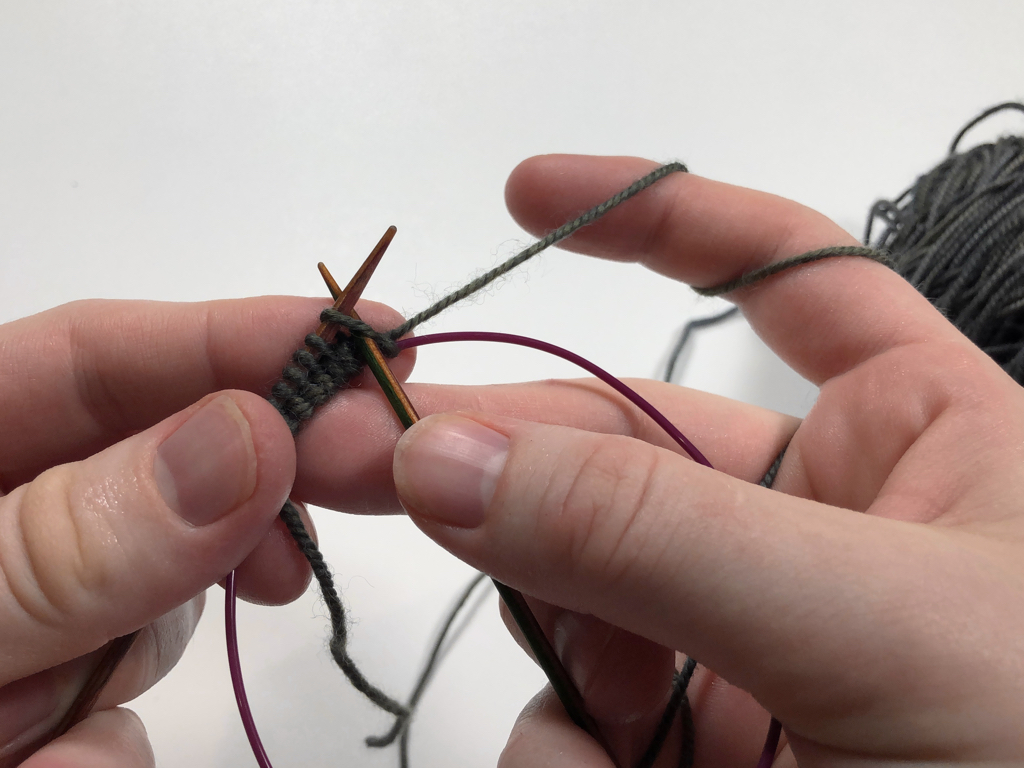 Learn how to work Judy’s Magic Cast-On to seamlessly start knitting in knit or purl. It’s a great cast-on to use for toe-up socks and other projects that start from the center out. #knitting #knittingcaston #knittingtutorials | withwool.com