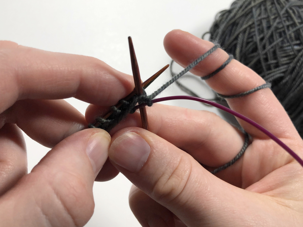 Learn how to work Judy’s Magic Cast-On to seamlessly start knitting in knit or purl. It’s a great cast-on to use for toe-up socks and other projects that start from the center out. #knitting #knittingcaston #knittingtutorials | withwool.com