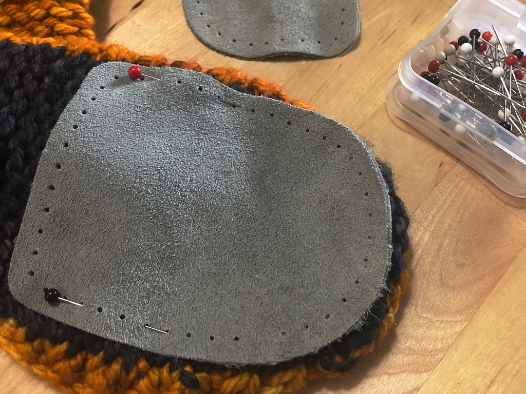 Learn how to sew soles onto your slippers for extra grip and added durability. #knitting | withwool.com