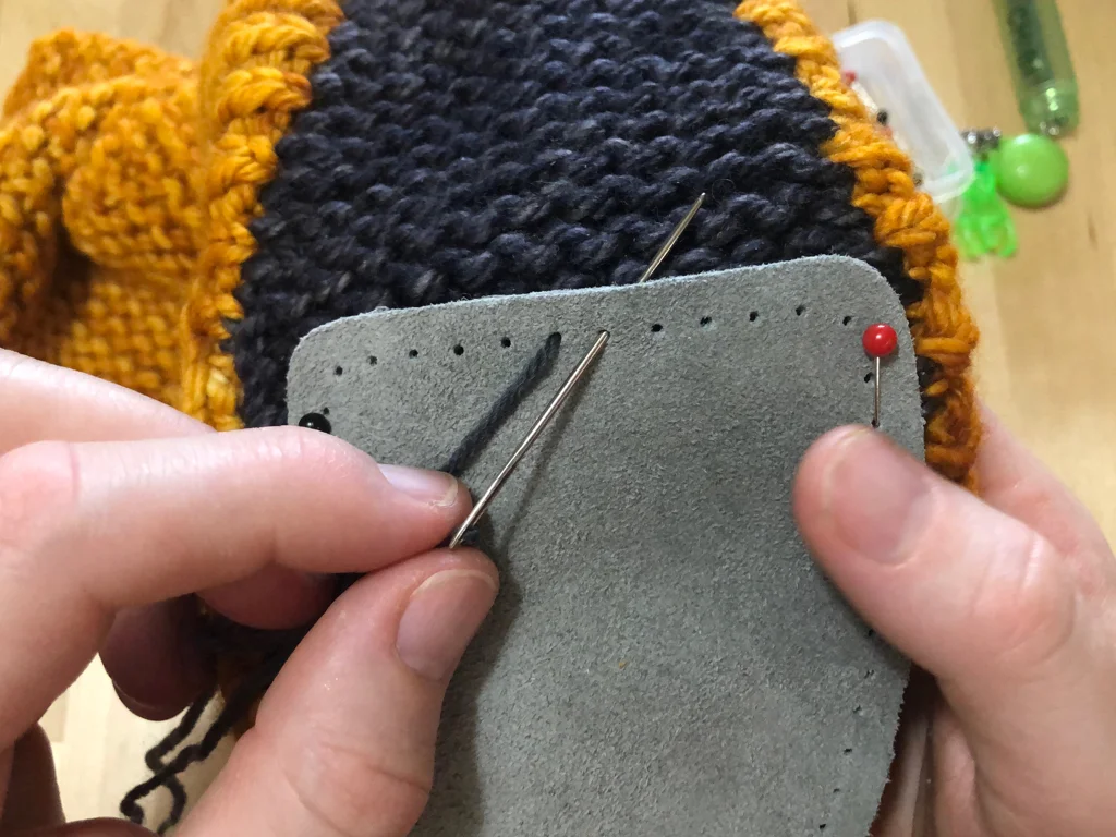 Learn how to sew soles onto your slippers for extra grip and added durability. #knitting | withwool.com