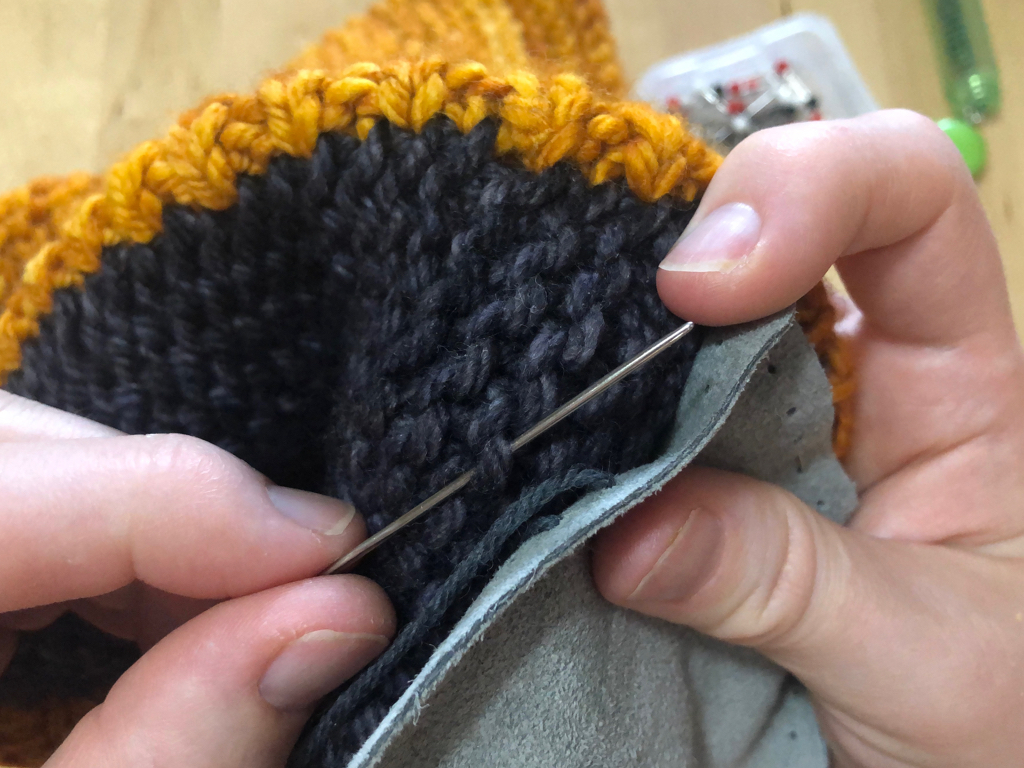 Learn how to sew soles onto your slippers for extra grip and added durability. #knitting | withwool.com